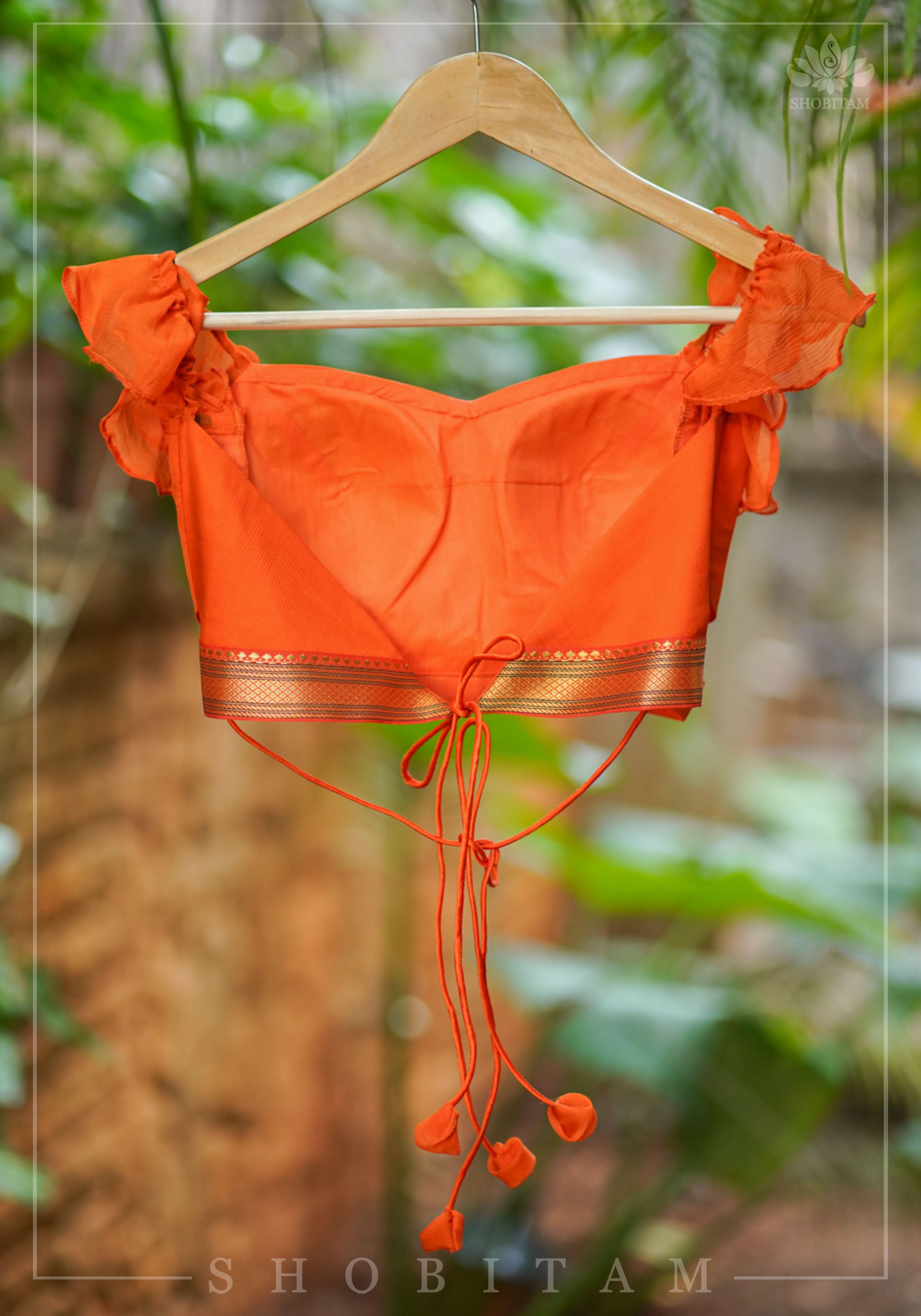 Orange chiffon sweetheart neck blouse with ruffle sleeves | Shobitam