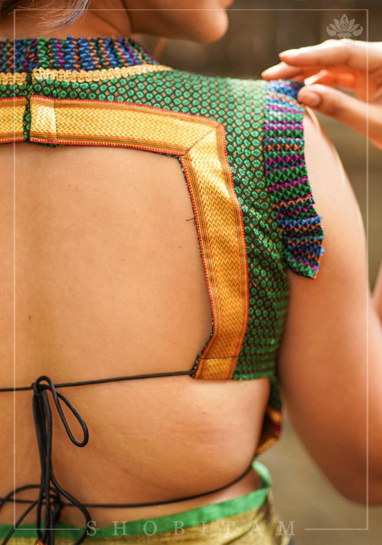 Dark green & black khana silk V neck blouse with frill detailing and backless design< made to order