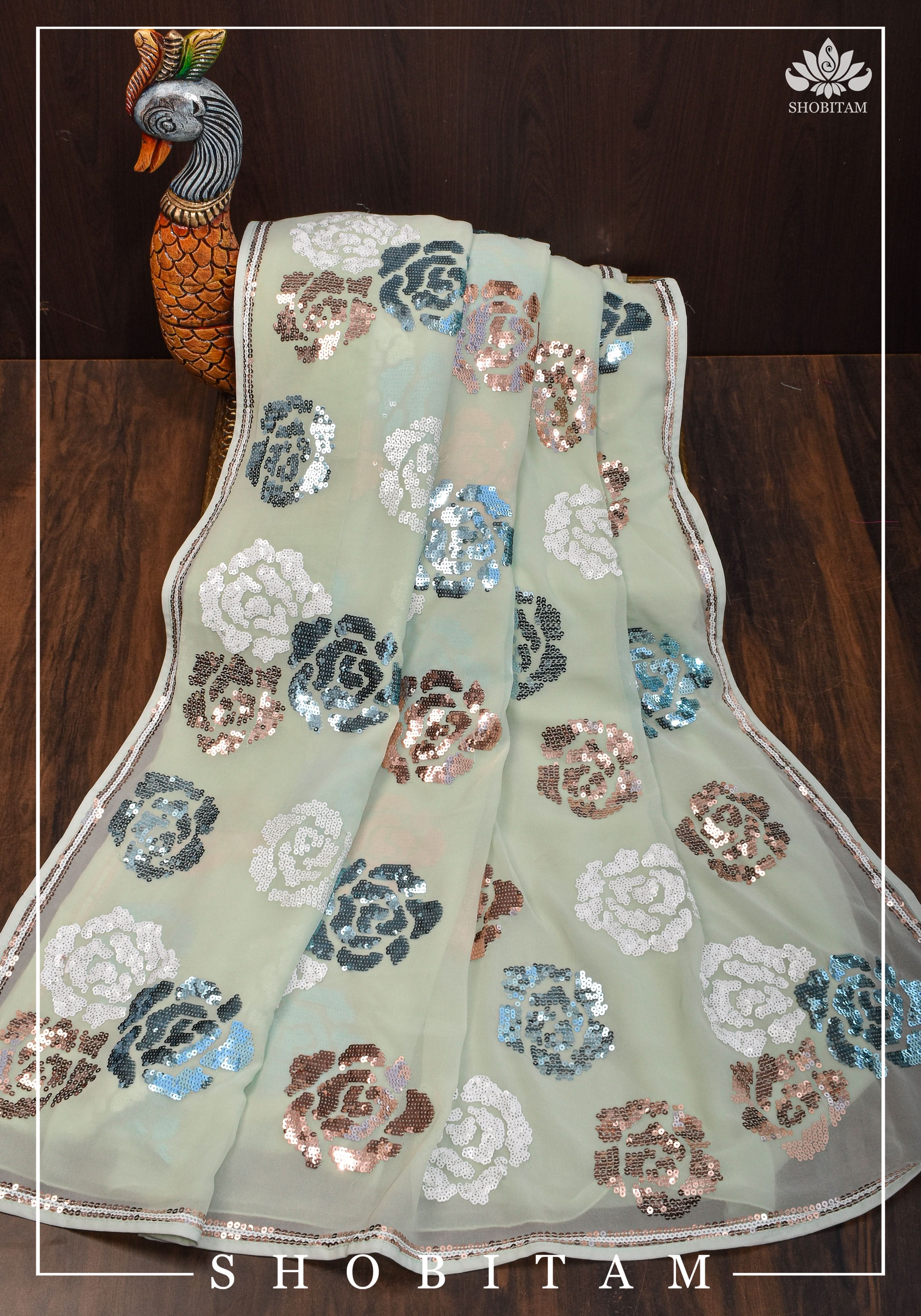 Georgette Saree in pale pista green with rose design sequin work | Shobitam