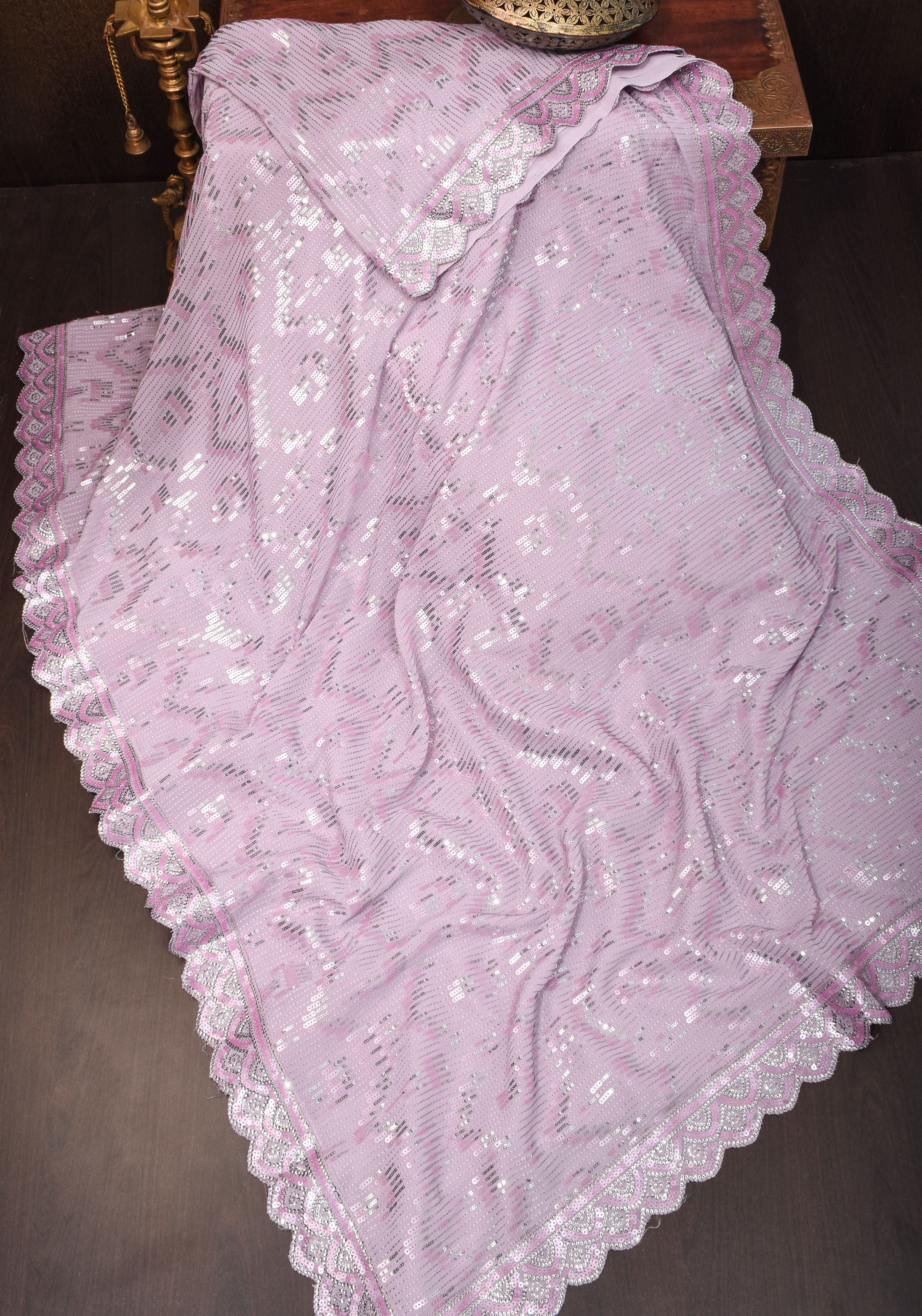 Full Sequins Embellished Georgette Saree in mauve with Scalloped border | Shobitam