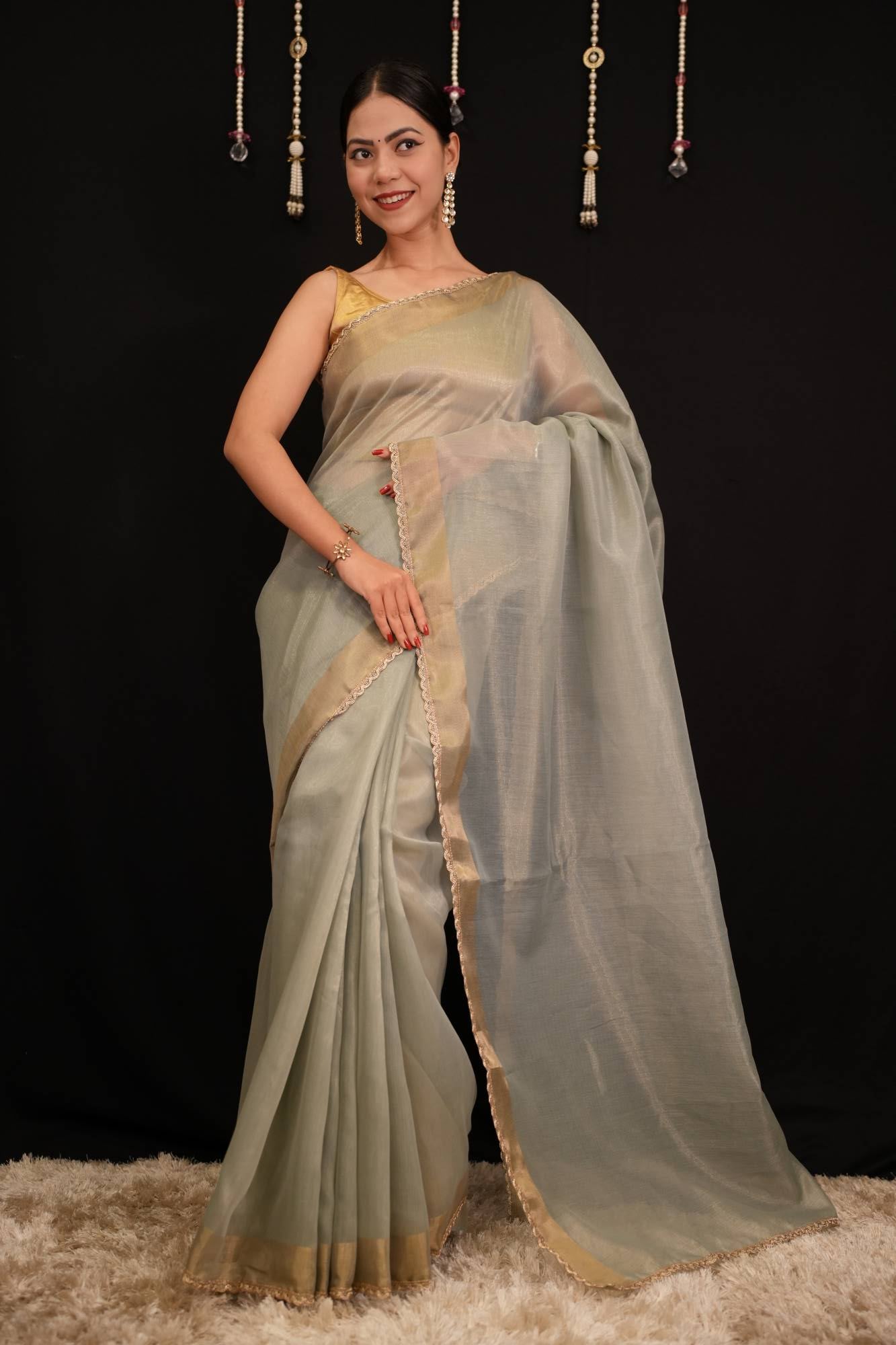 Pastel Green Soft Jimmy choo Fabric With Zari Weave Border And Golden Zari Piping Lace Pre Drape Saree