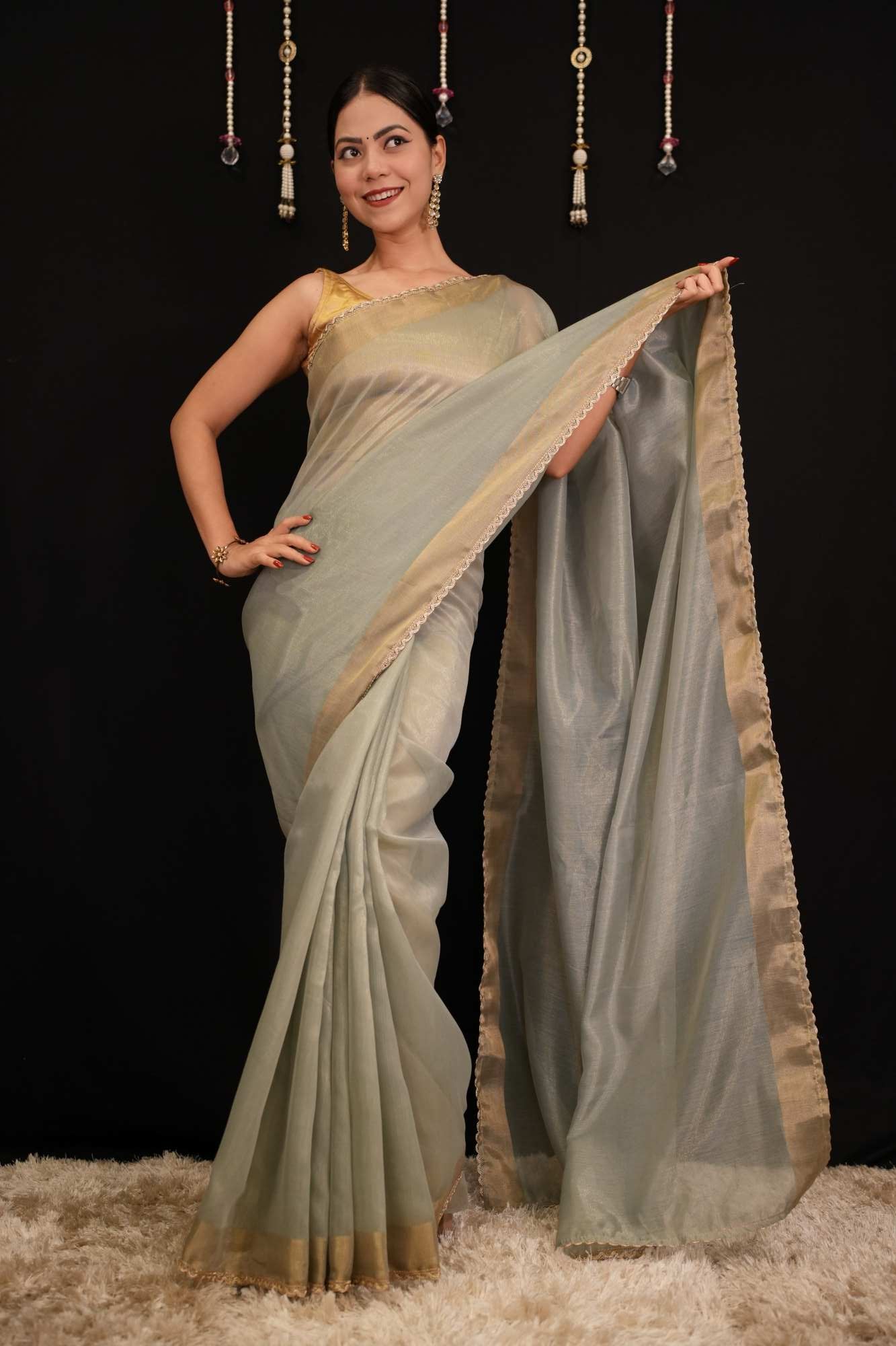 Pastel Green Soft Jimmy choo Fabric With Zari Weave Border And Golden Zari Piping Lace Pre Drape Saree