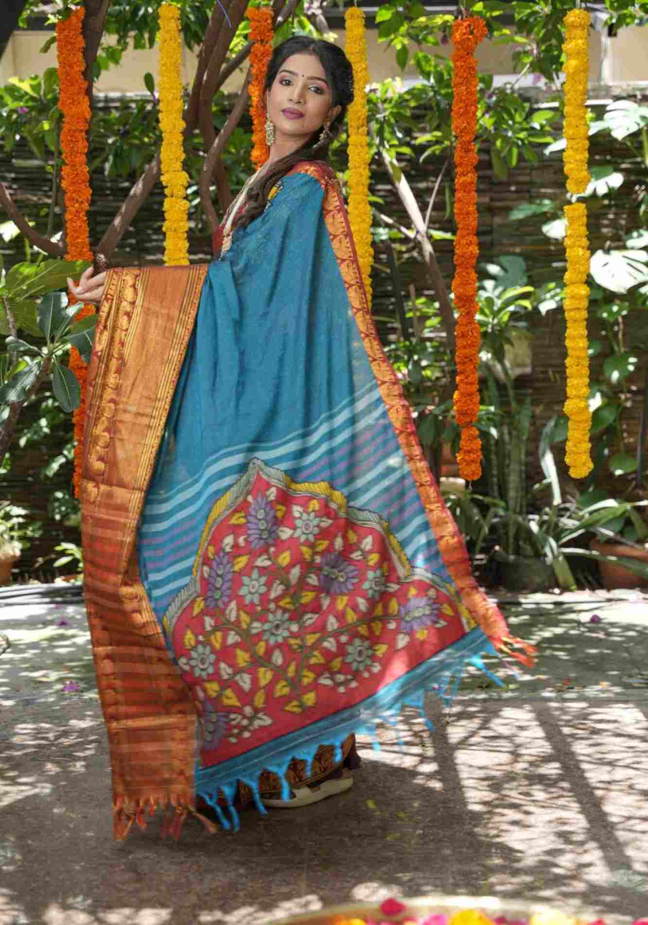 Peacock blue Narayanpet saree with pen kalamkari appliqué and wide zari borders Pre Drape Saree