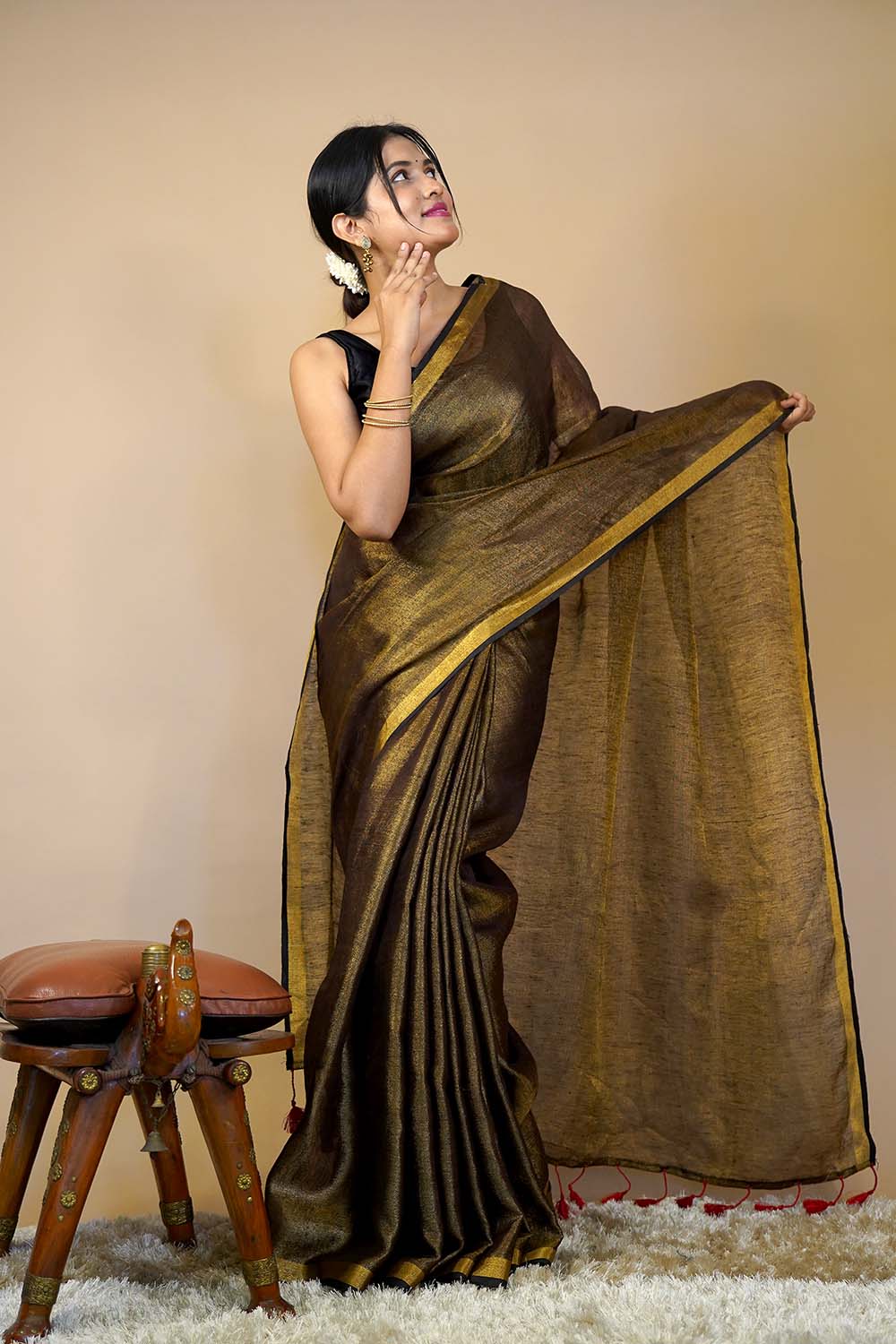 Actress Sobhita Dhulipala ( @sobhitad )slaying it in our iconic “The  Original Liquid Molten Gold Metallic Saree” & striped gold black... |  Instagram