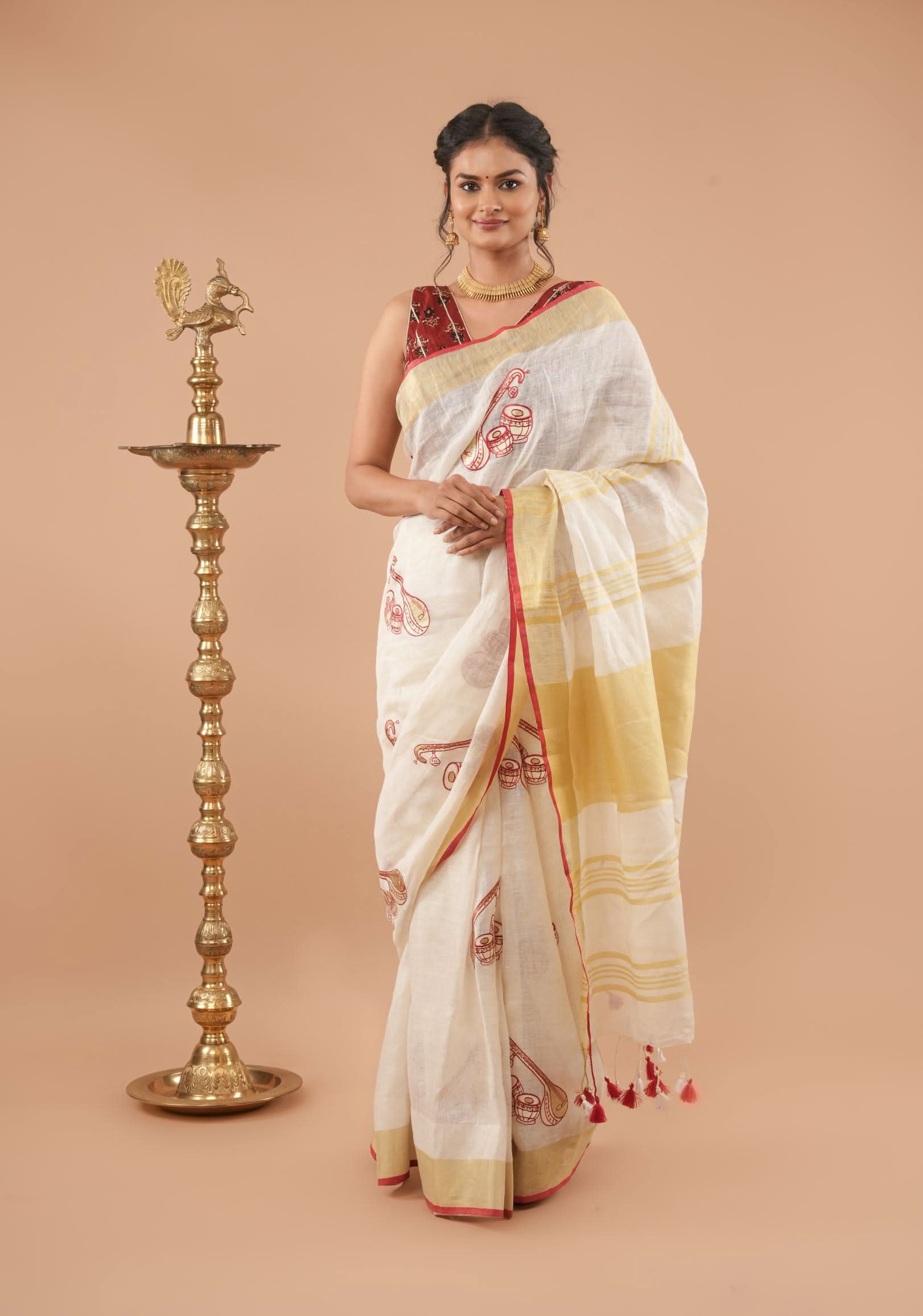 Linen by Linen Saree in White with Musical instruments embroidery motifs | Shobitam