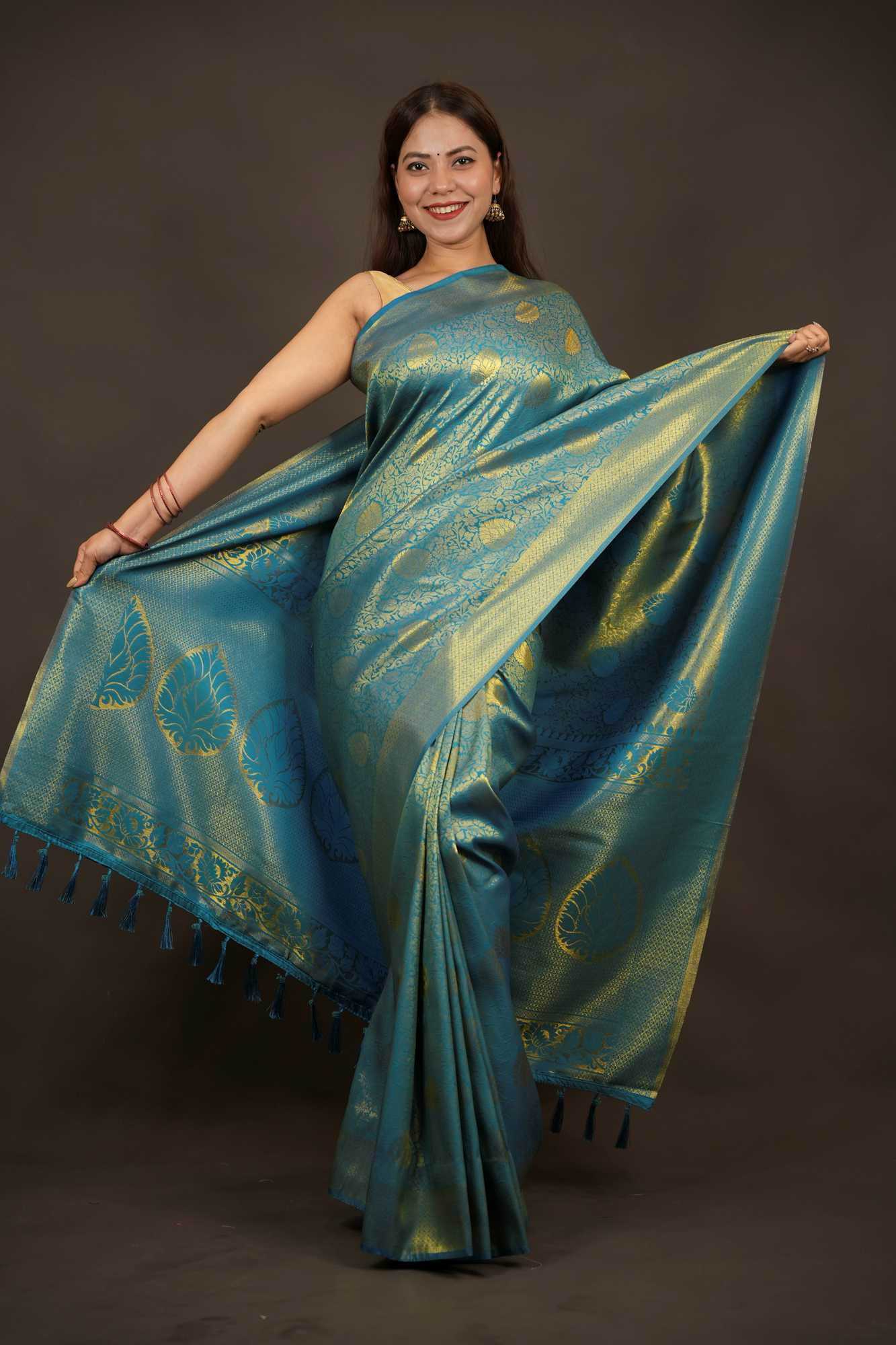 Traditional Kanjivaram with grand pallu and self weaving dhoop chaanv zari work prestitched saree