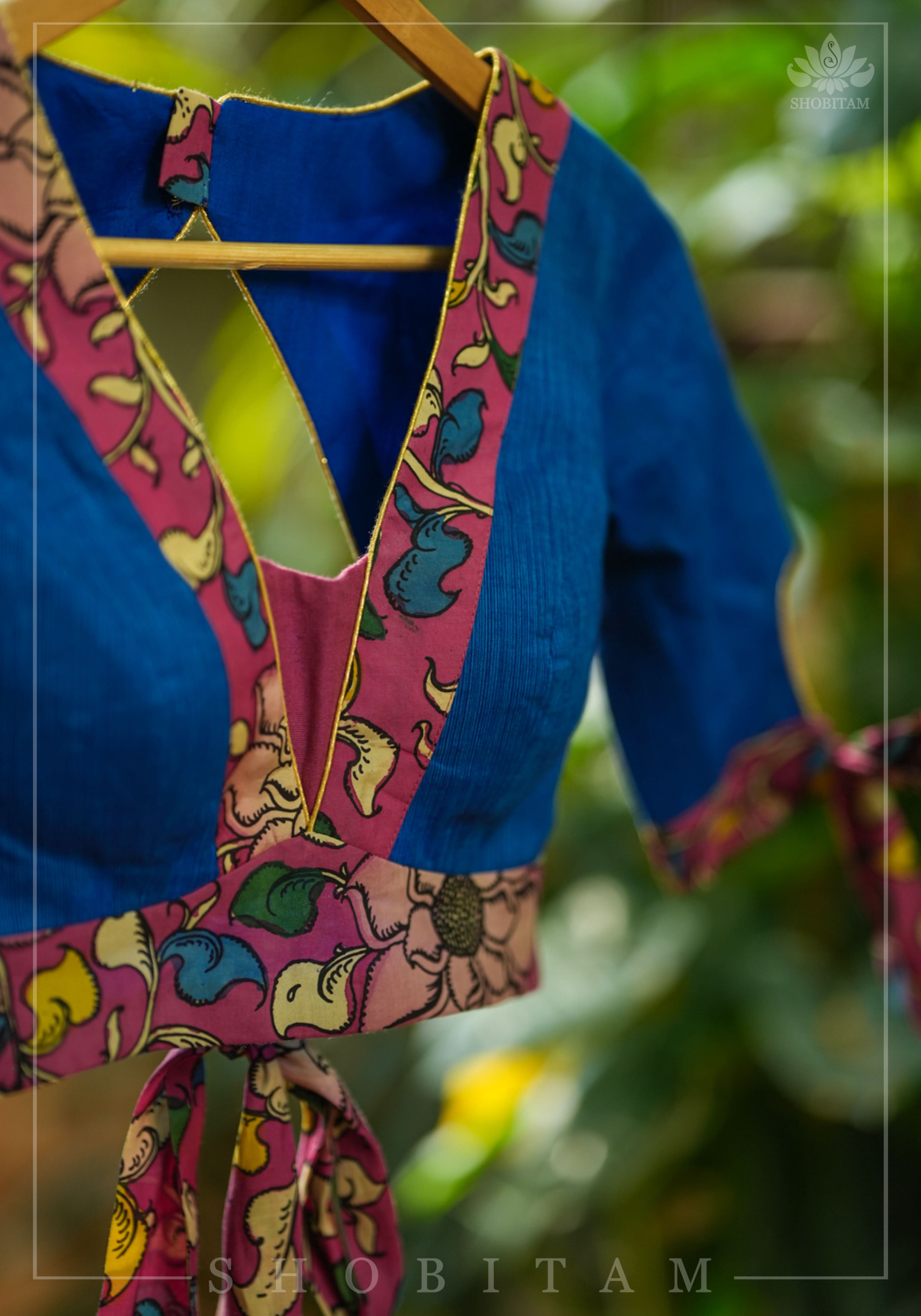 Ocean blue handloom V neck blouse with rose pink handpainted kalamkari border detailing. | Shobitam