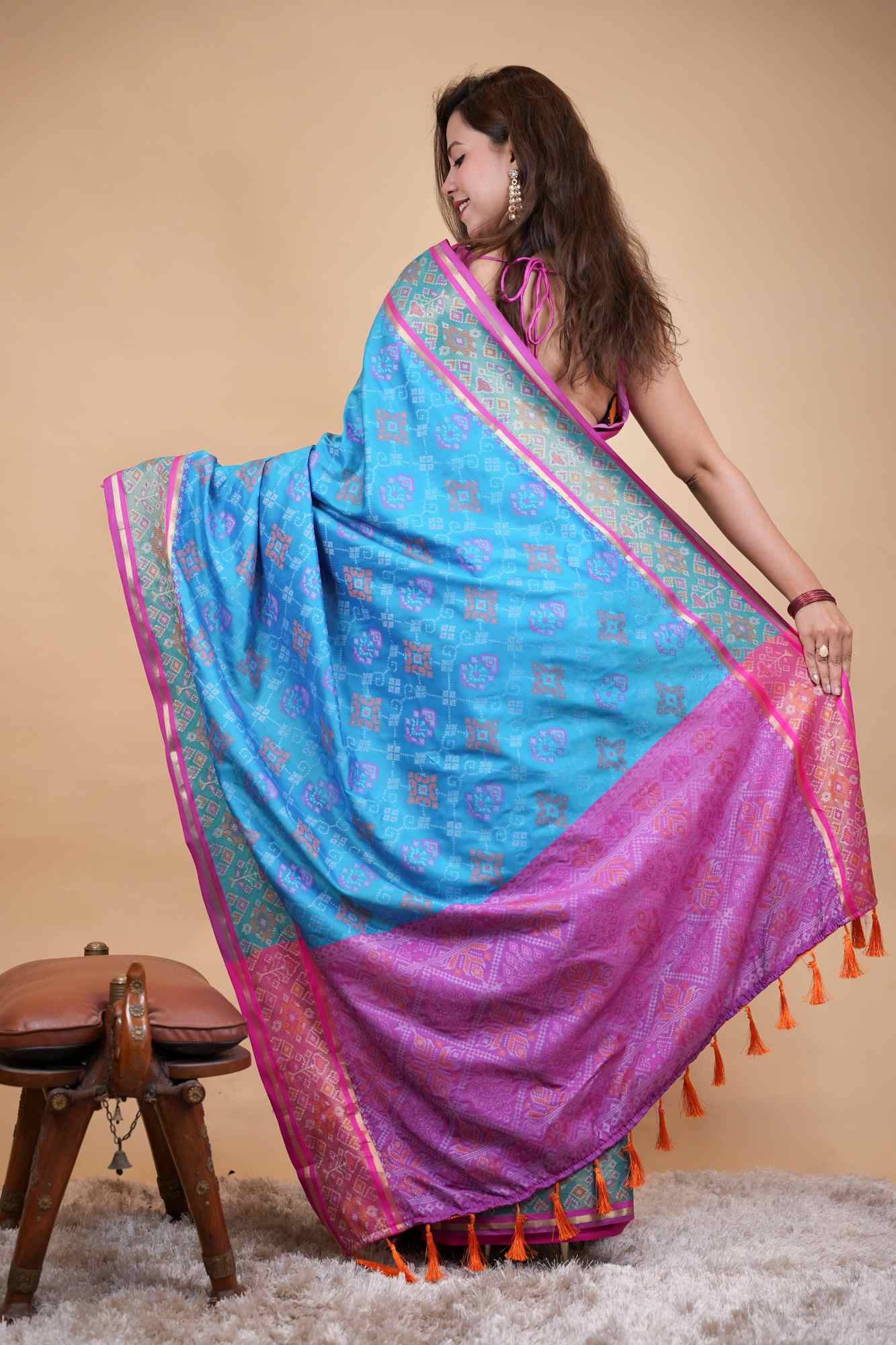 Firozi Patola weave and zari interwoven with resham border tassels i pallu prestitched saree