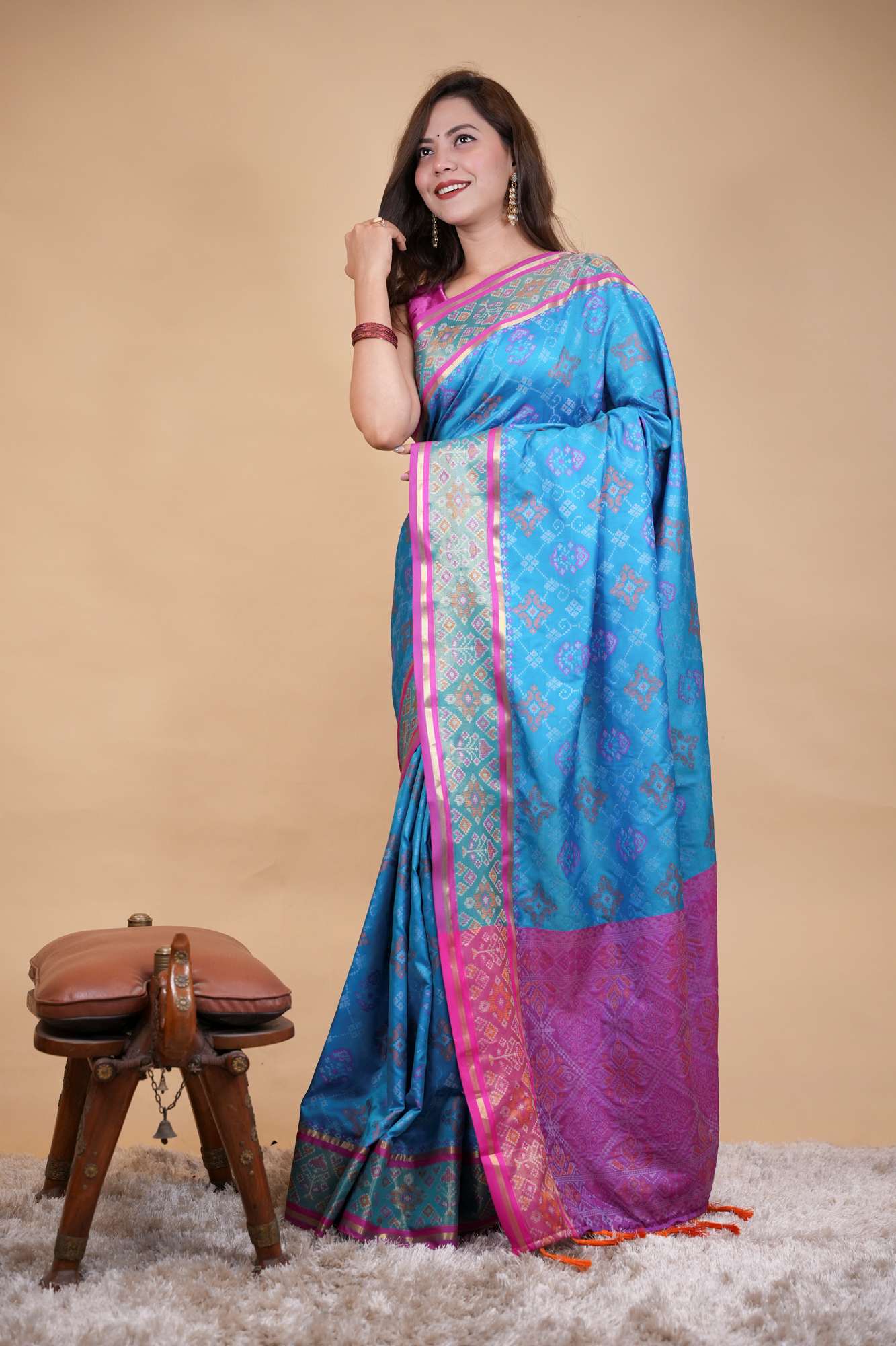 Firozi Patola weave and zari interwoven with resham border tassels i pallu prestitched saree