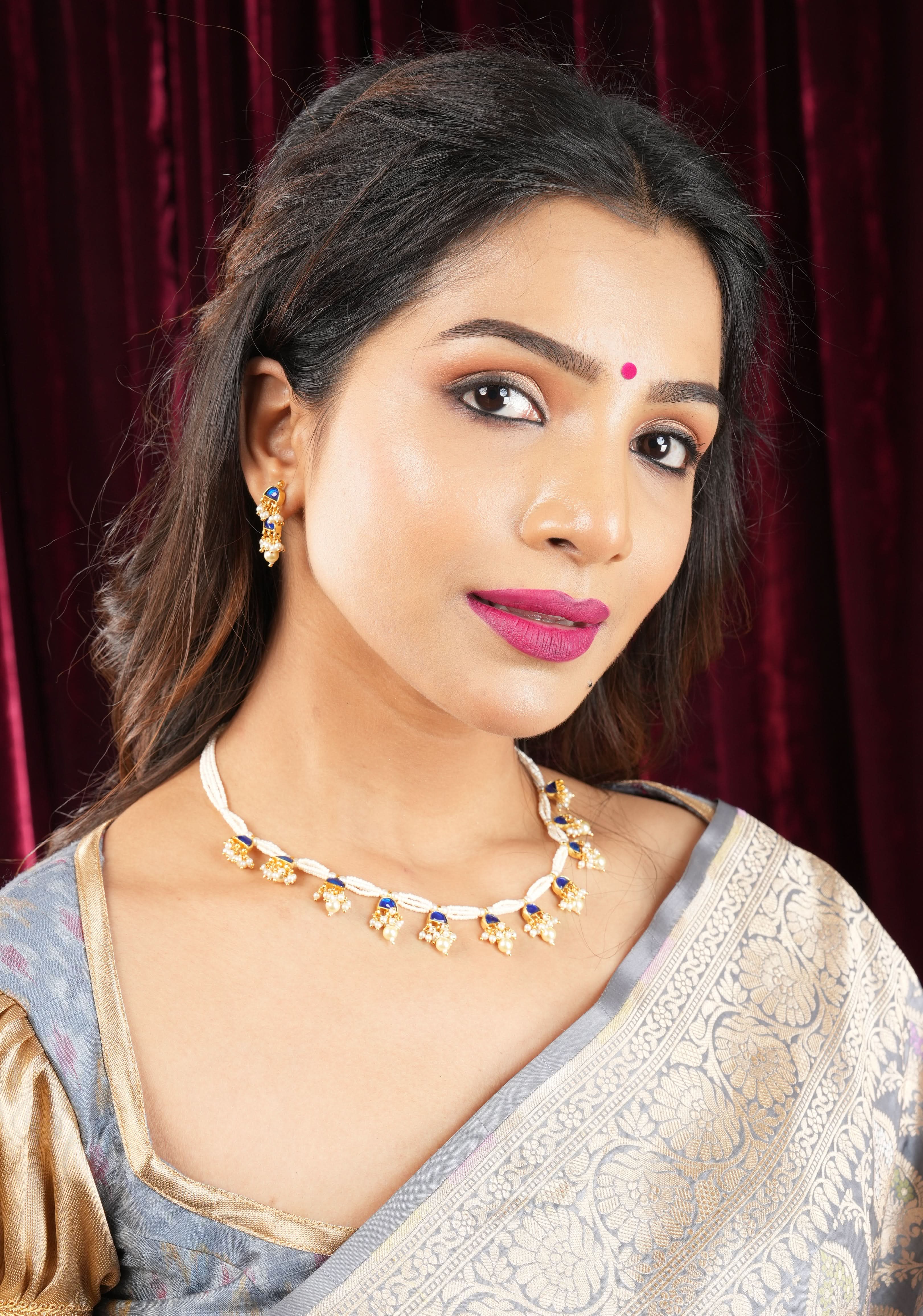 Lightweight Jadau Necklace Set with eleven dangling royal blue stones and matching earrings | Shobitam Jewelry