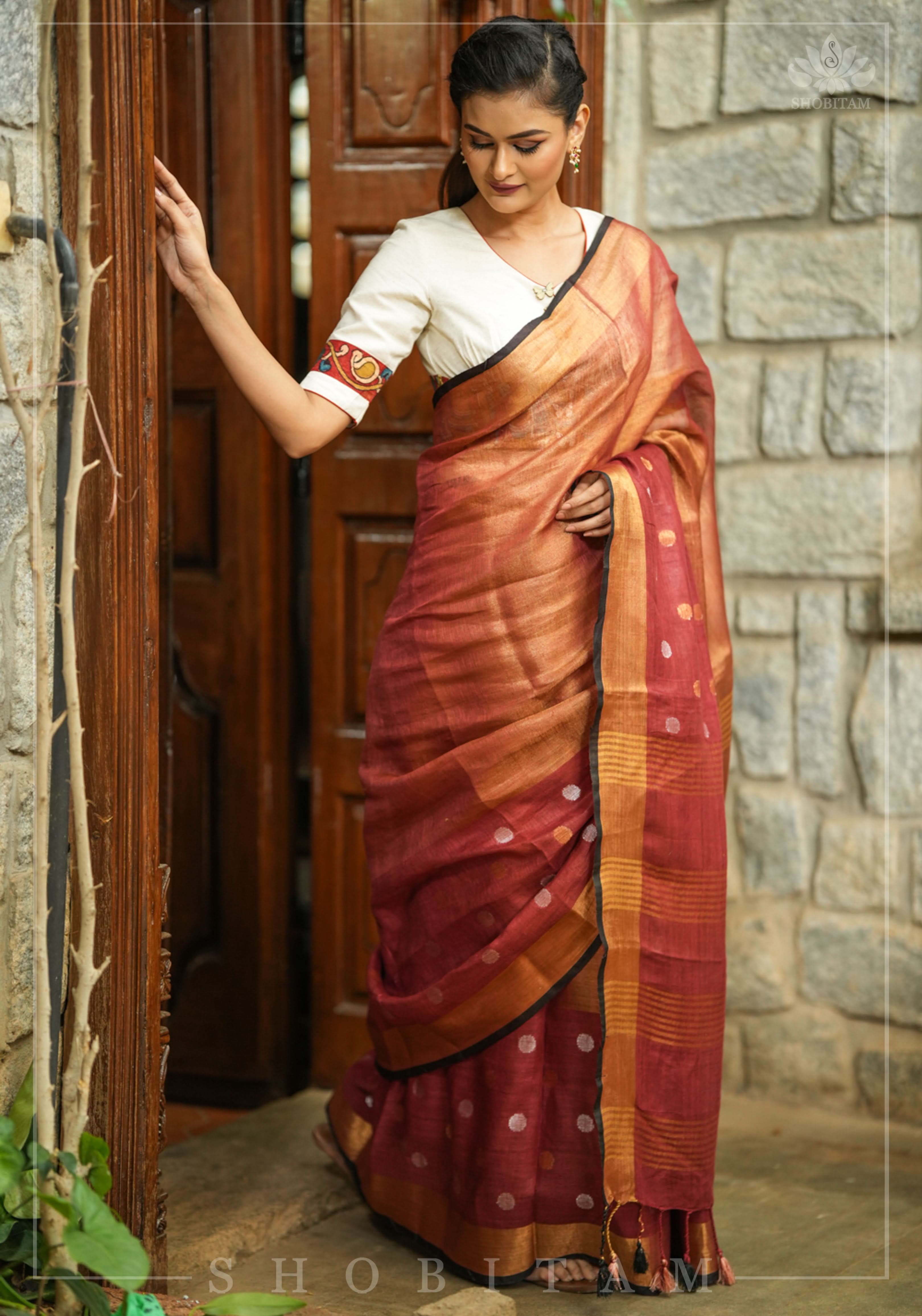 Maroon Tissue Body Linen Saree in Muted Antique Gold with Sona Rupa Polka Dots Skirt Border | Shobitam