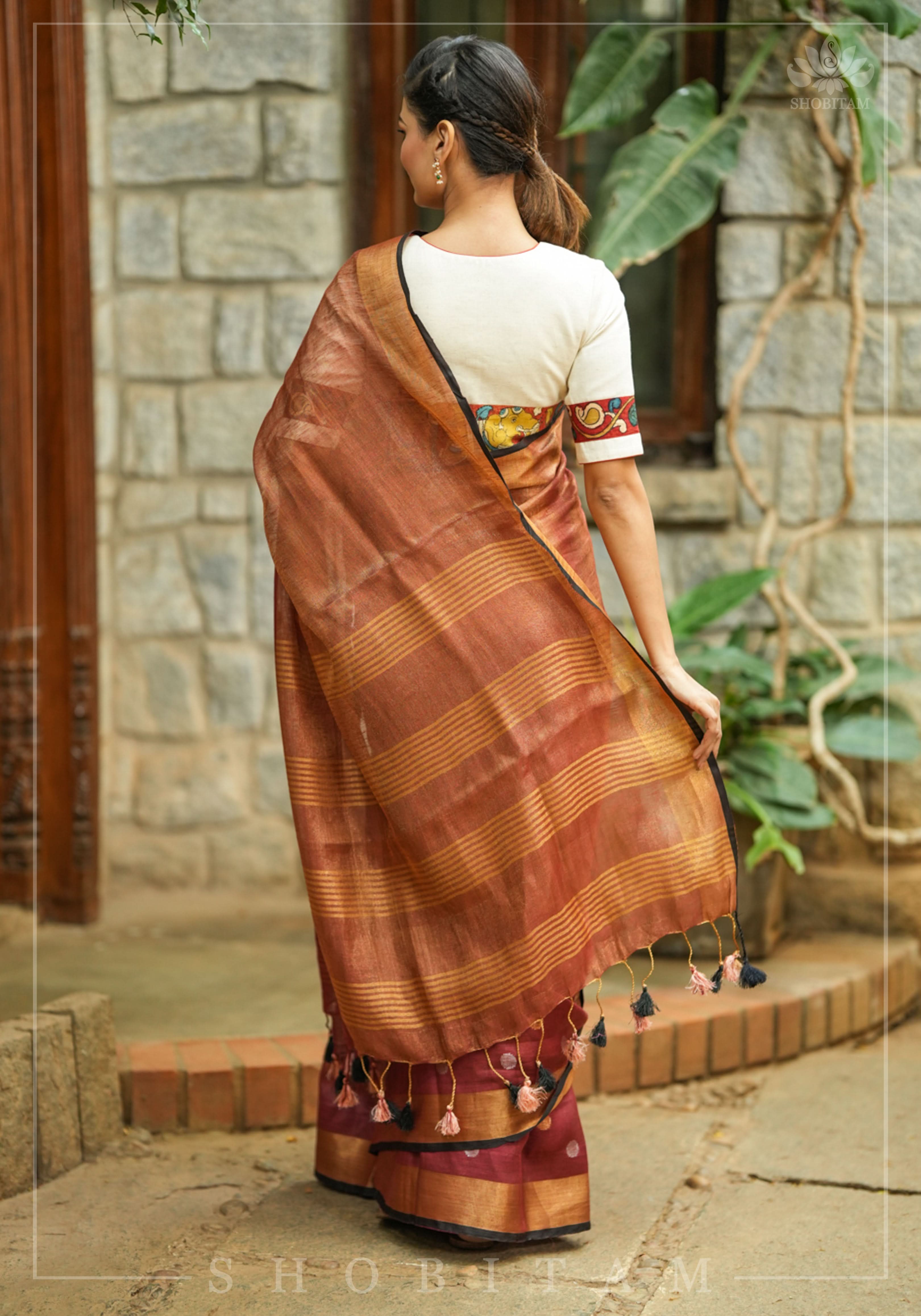 Maroon Tissue Body Linen Saree in Muted Antique Gold with Sona Rupa Polka Dots Skirt Border | Shobitam