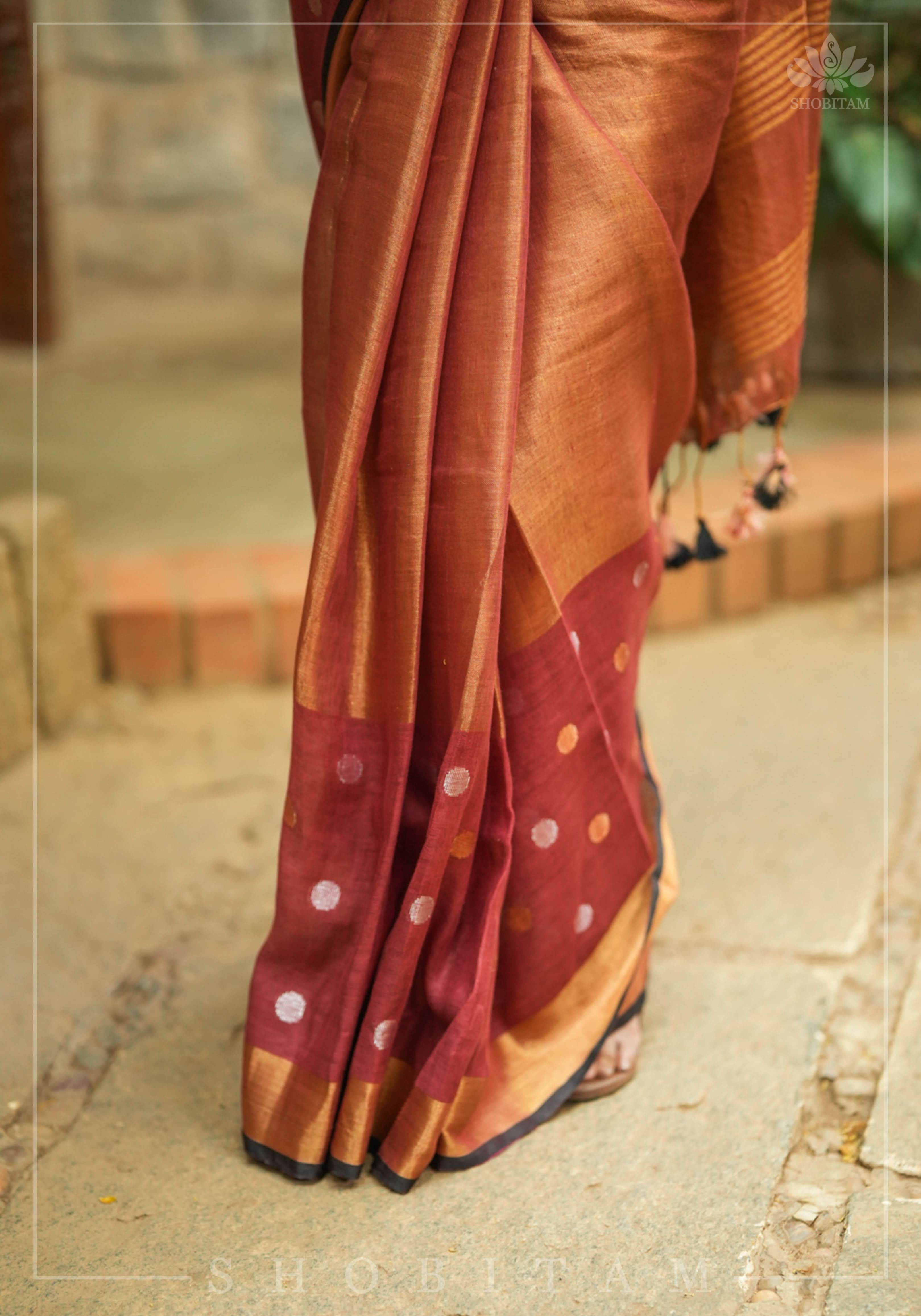 Maroon Tissue Body Linen Saree in Muted Antique Gold with Sona Rupa Polka Dots Skirt Border | Shobitam