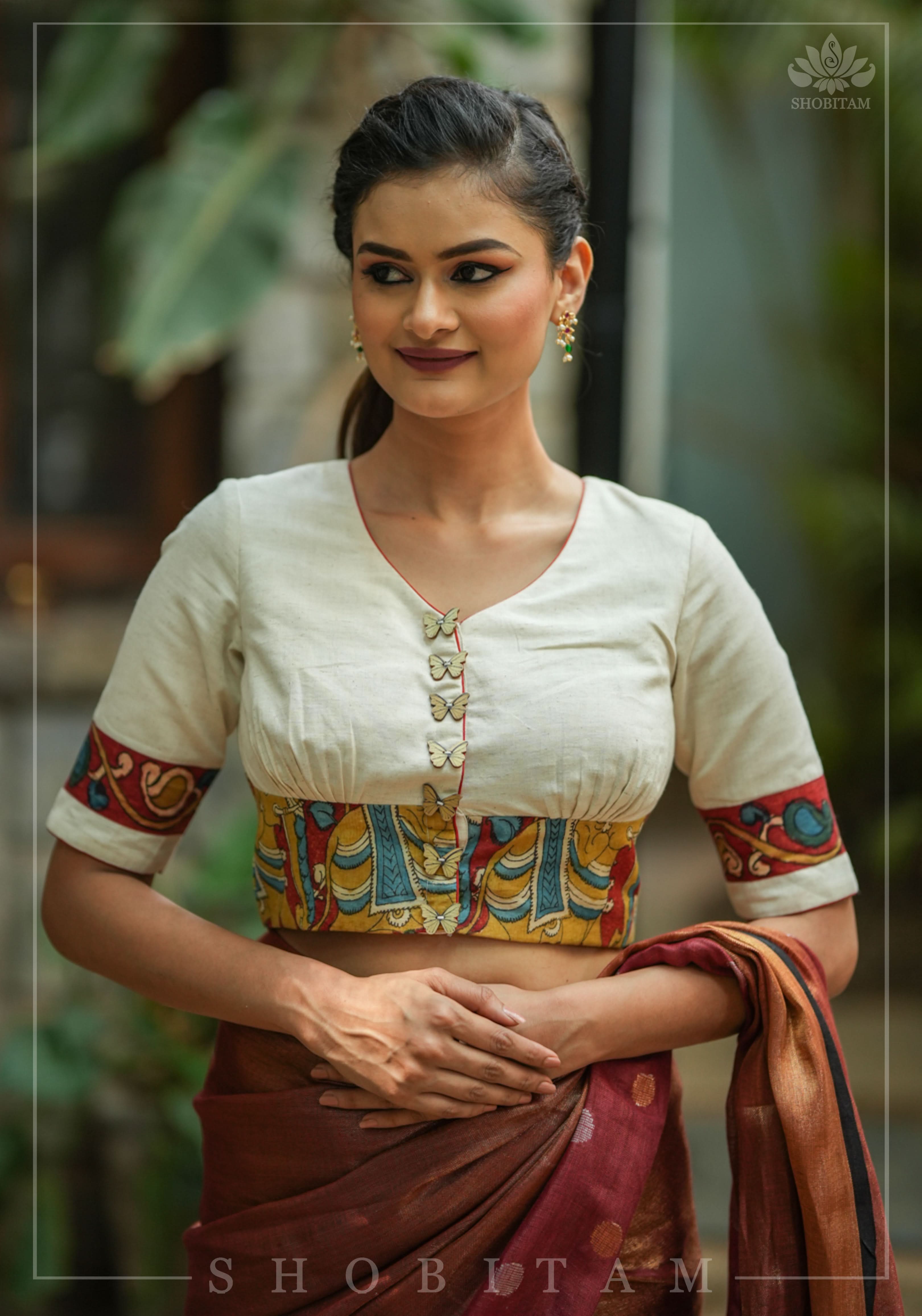 Daisy white V neck blouse with handpainted kalamkari border | Shobitam