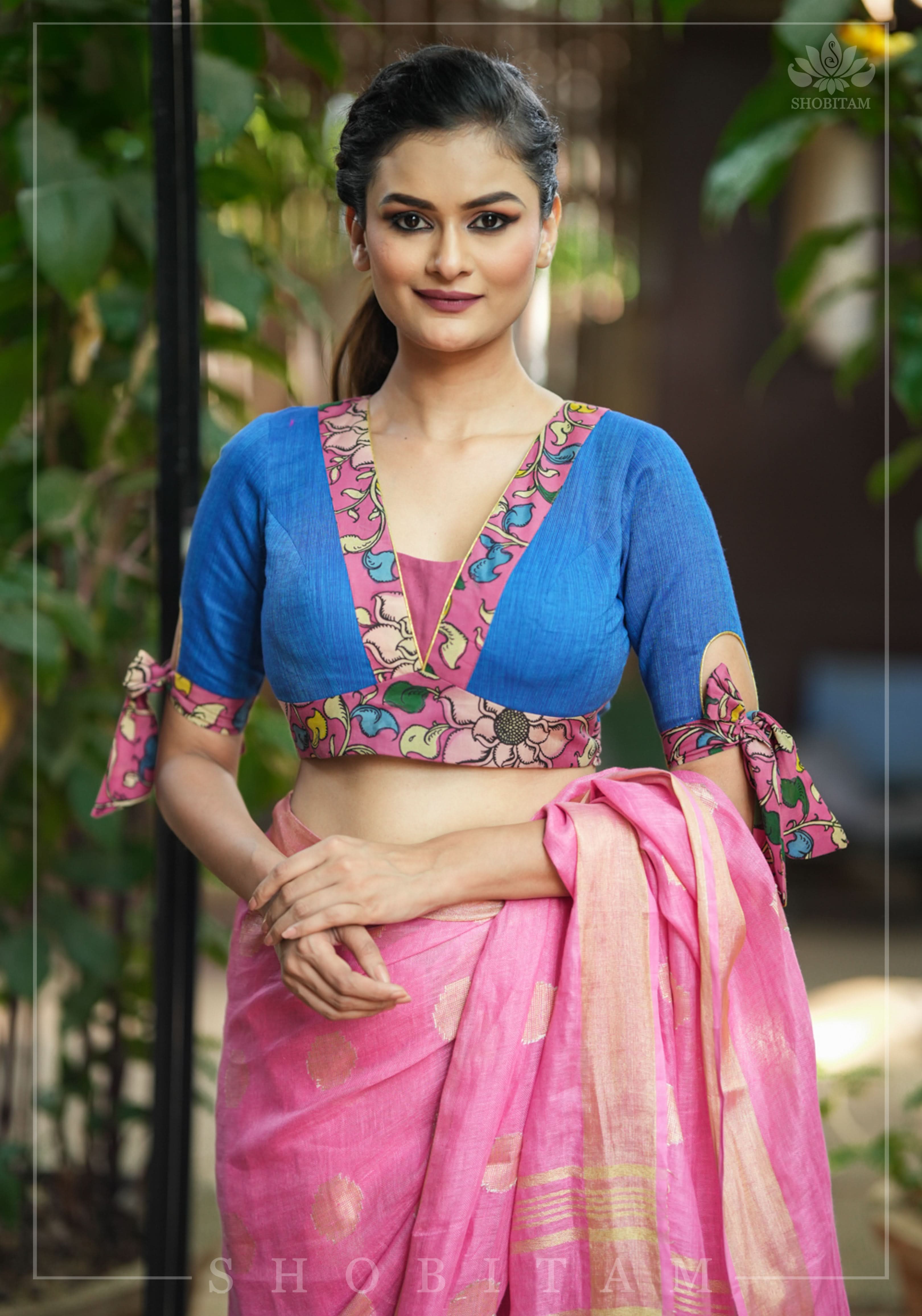 Ocean blue handloom V neck blouse with rose pink handpainted kalamkari border detailing. | Shobitam