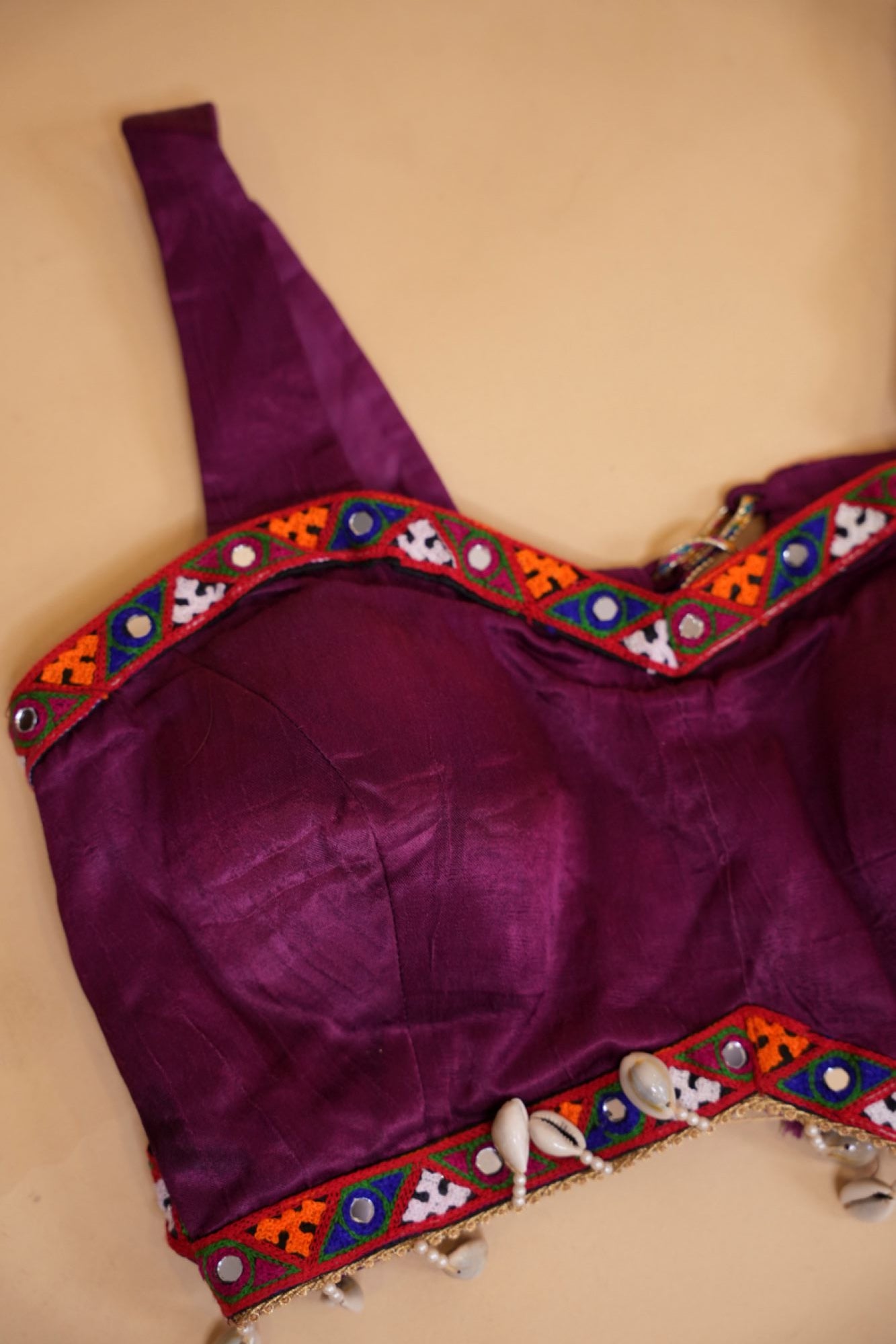 Stylish Navratri-Inspired Purple Blouse with Multicolor Embroidered Border & Cowrie Shell Accents