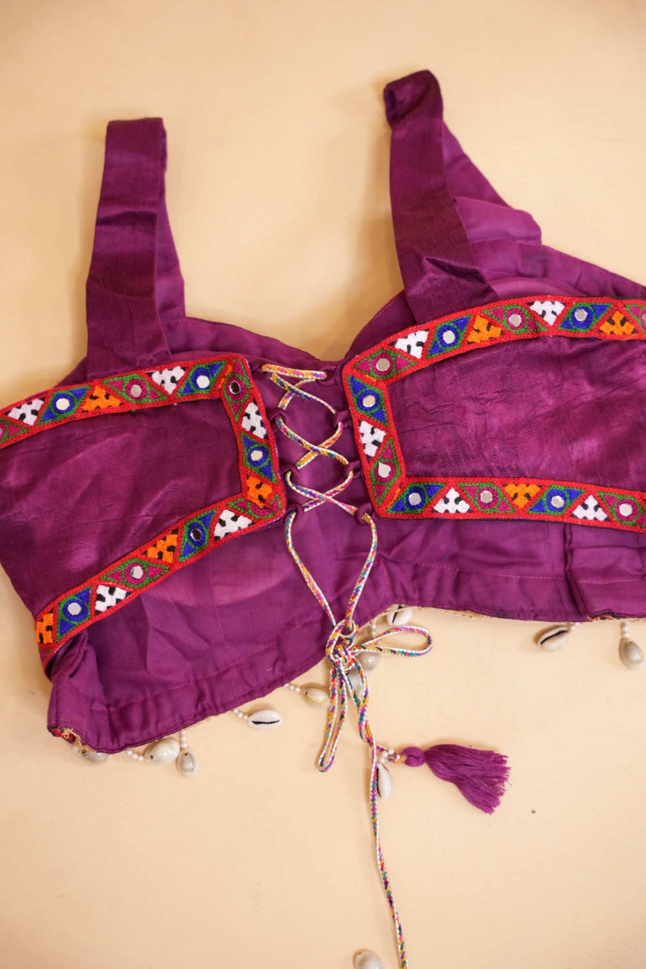 Stylish Navratri-Inspired Purple Blouse with Multicolor Embroidered Border & Cowrie Shell Accents