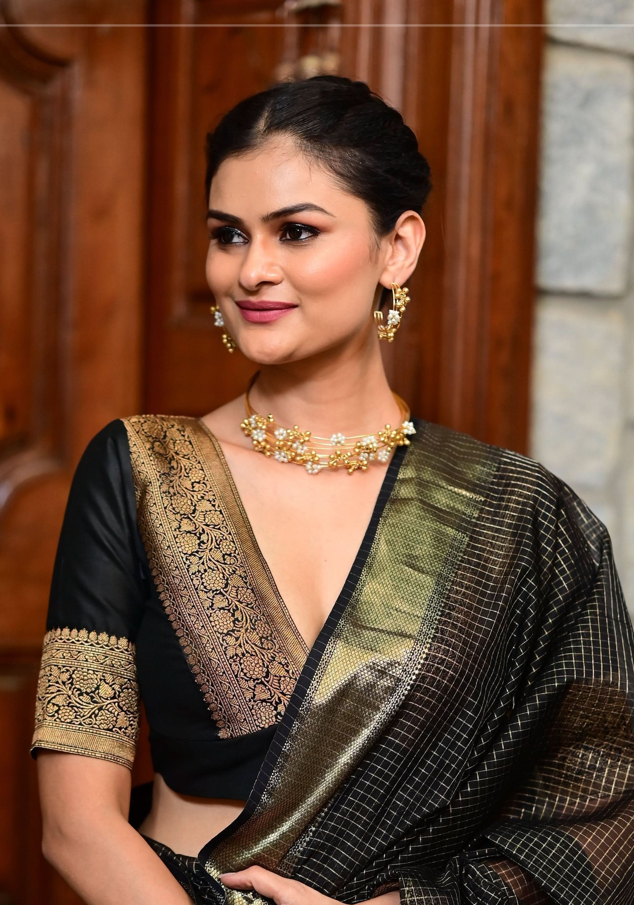 Black Blouse with Plunge Neck and Antique Tone Zari Detailing | Shobitam
