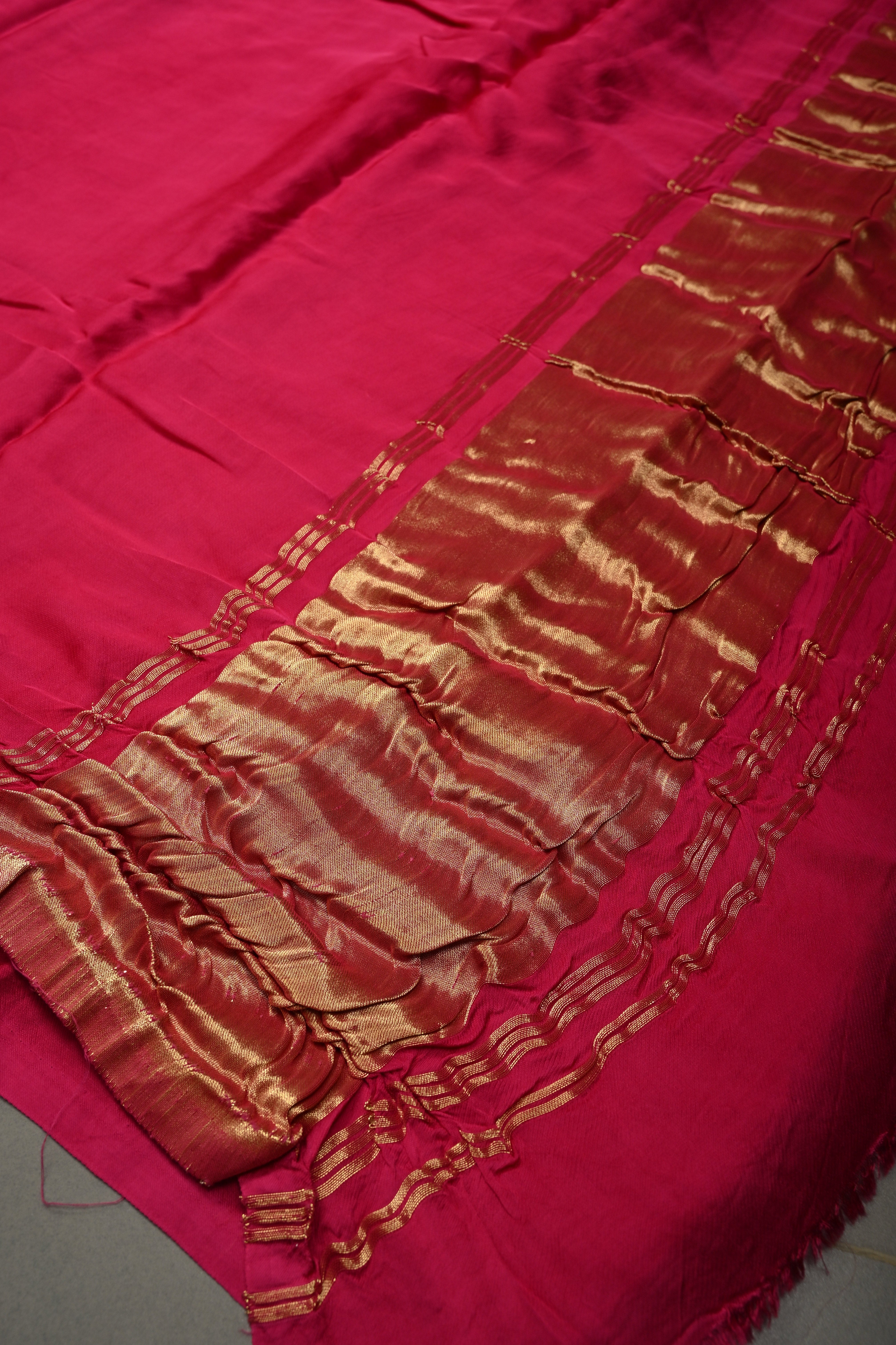 Rani Pink Borderless Modal Silk Saree with Lagda Patta Crushed Tissue Pallu | Shobitam