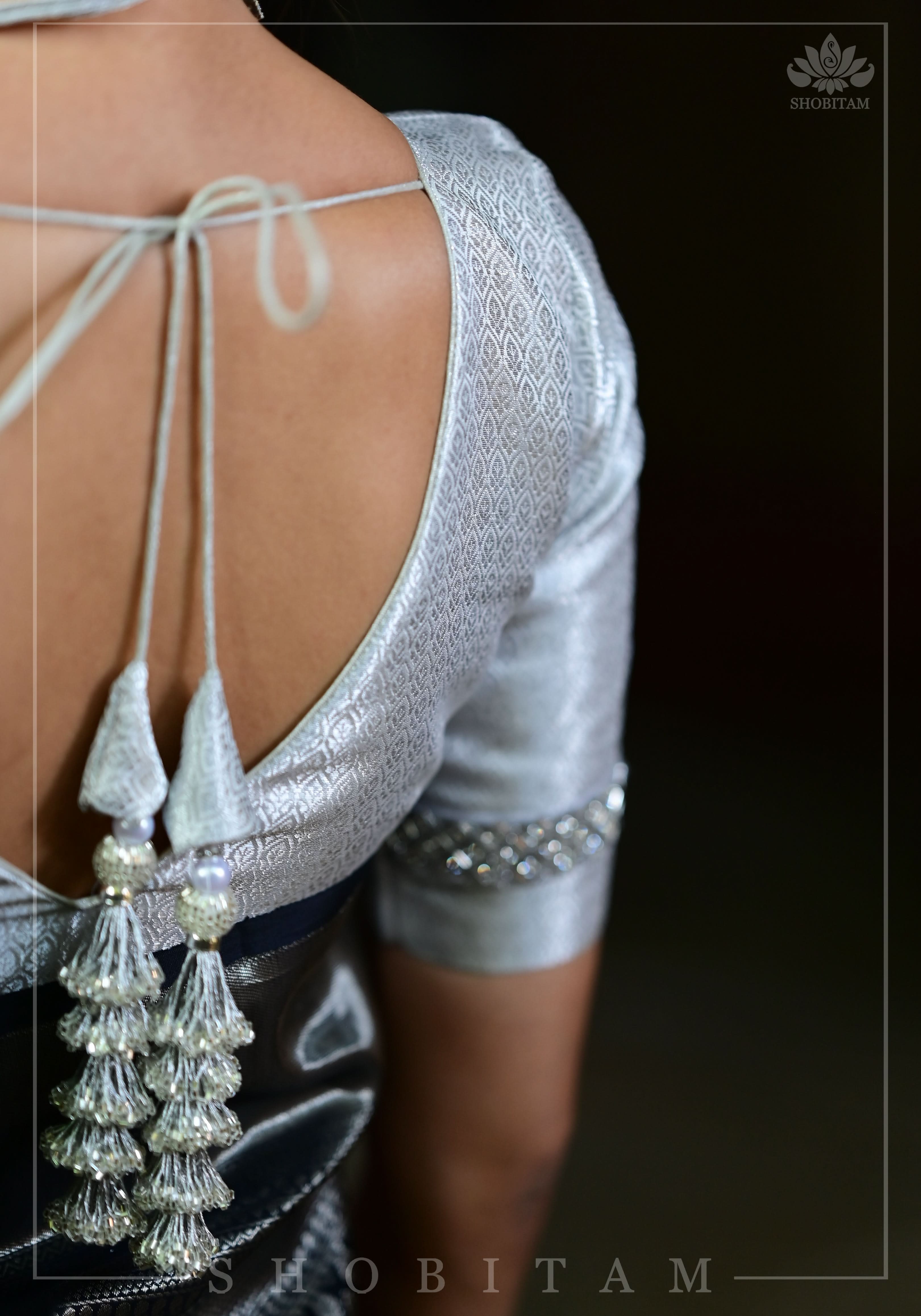 V neck Silver blouse with stonework Trim on Sleeve and cutdana tassels | Shobitam