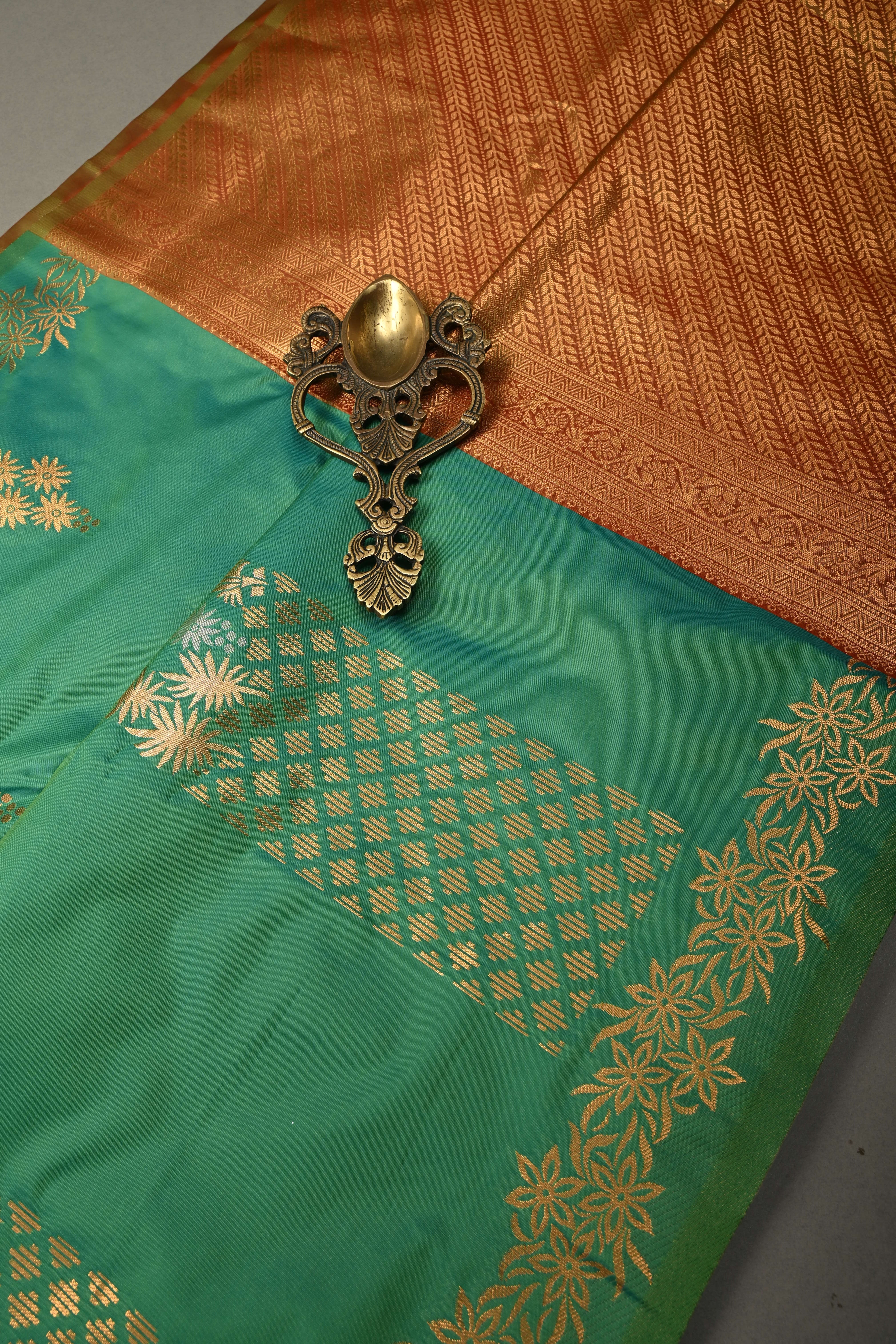 Green Kanchi Semi Silk Saree with Floral Zari Buttas and Gold-Silver Motifs on Border | Shobitam