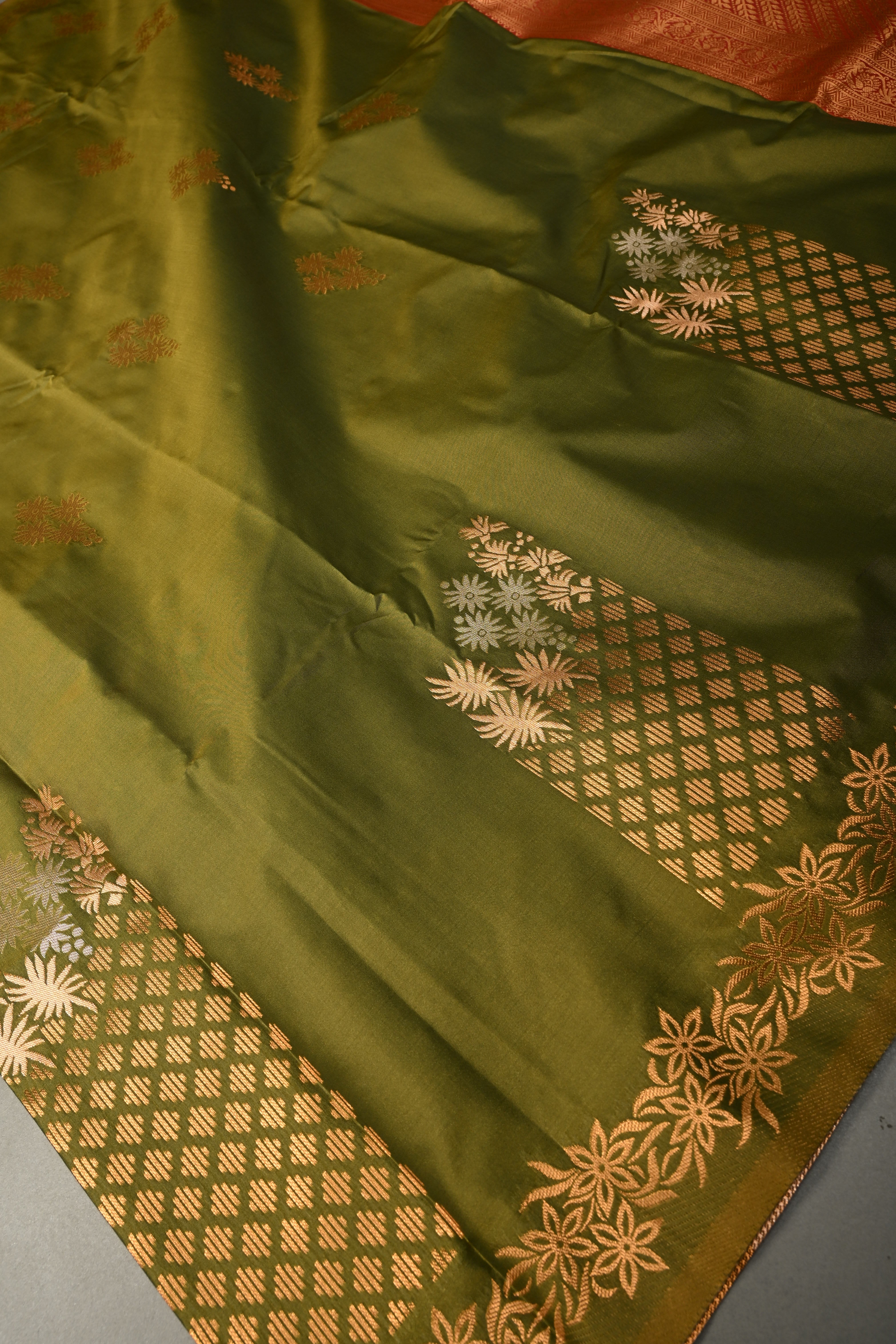Henna Green Kanchi Semi Silk Saree with Floral Zari Buttas and Gold-Silver Motifs on Border | Shobitam