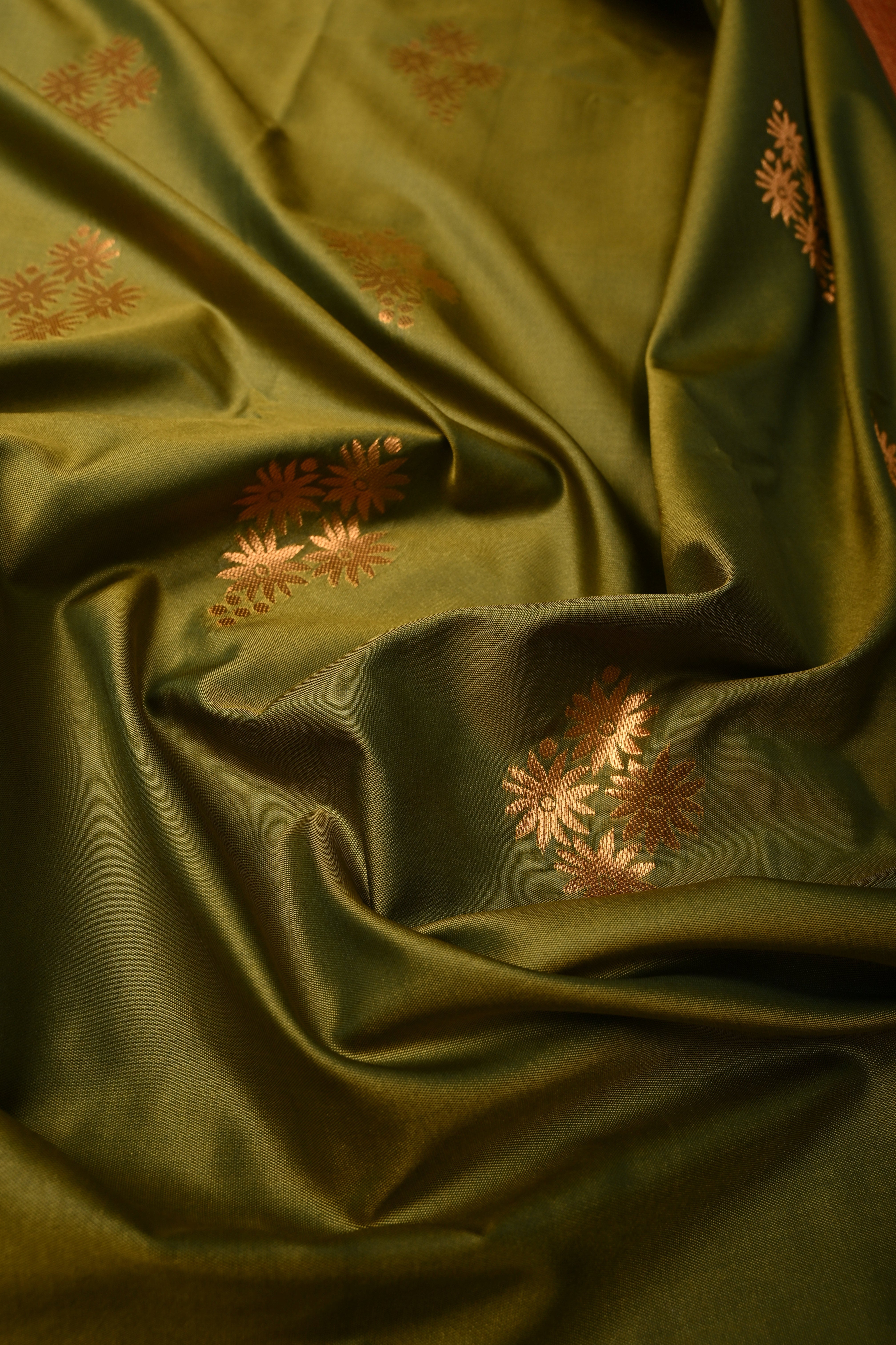 Henna Green Kanchi Semi Silk Saree with Floral Zari Buttas and Gold-Silver Motifs on Border | Shobitam