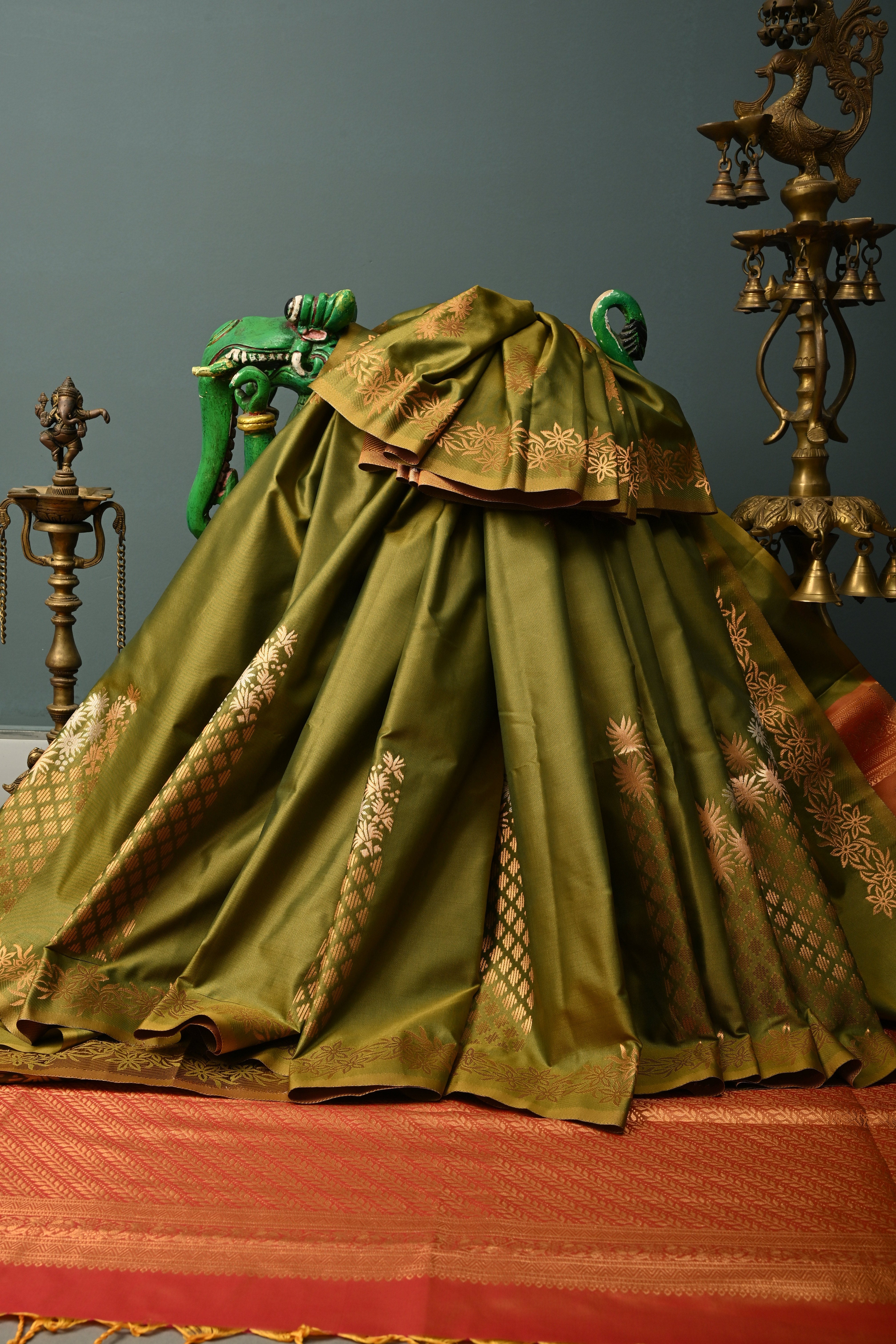 Henna Green Kanchi Semi Silk Saree with Floral Zari Buttas and Gold-Silver Motifs on Border | Shobitam