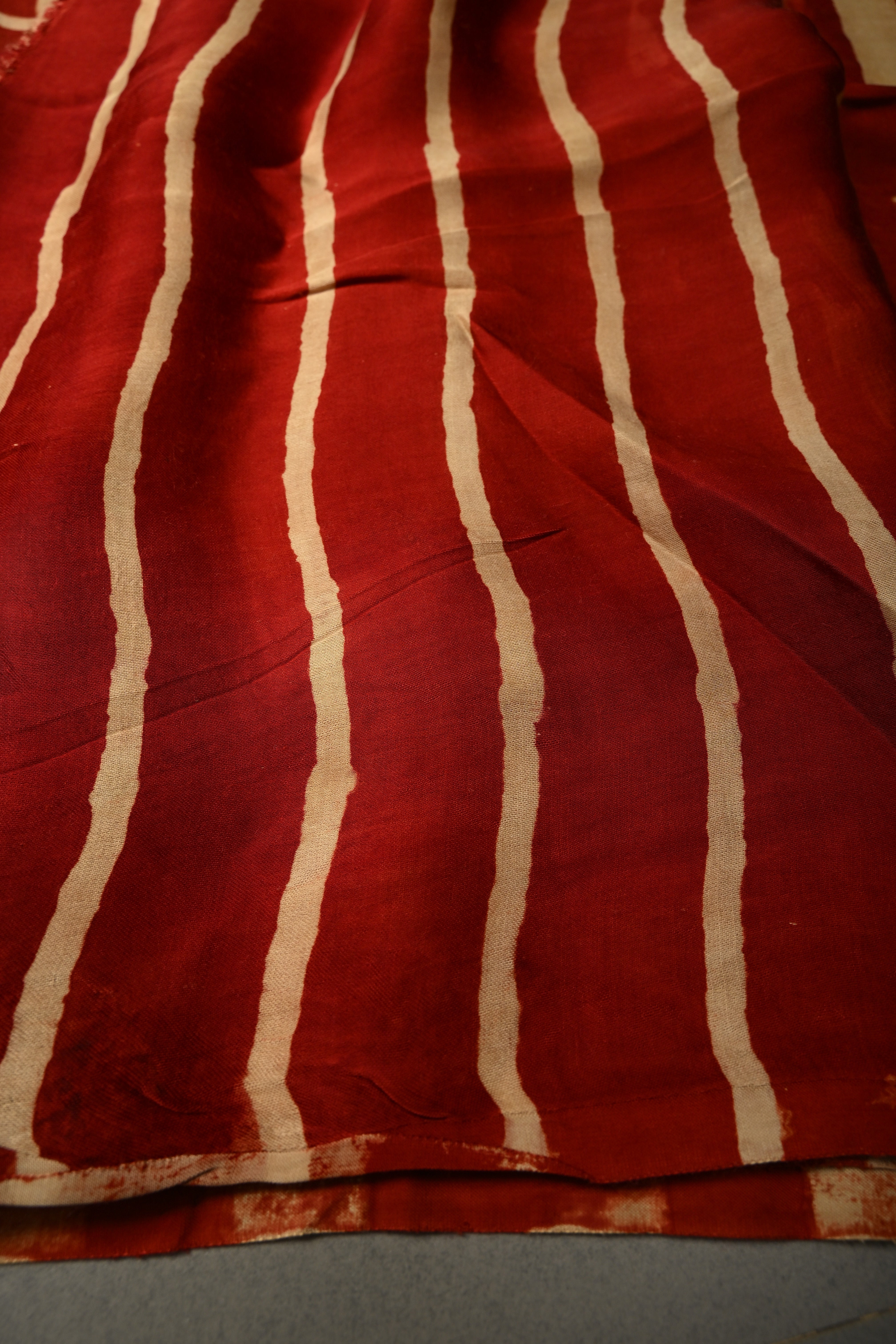 Beige-Red Borderless Modal Silk Saree with Stripes Hand Block Print and Contrast Black Checks Pattern Pallu | Shobitam