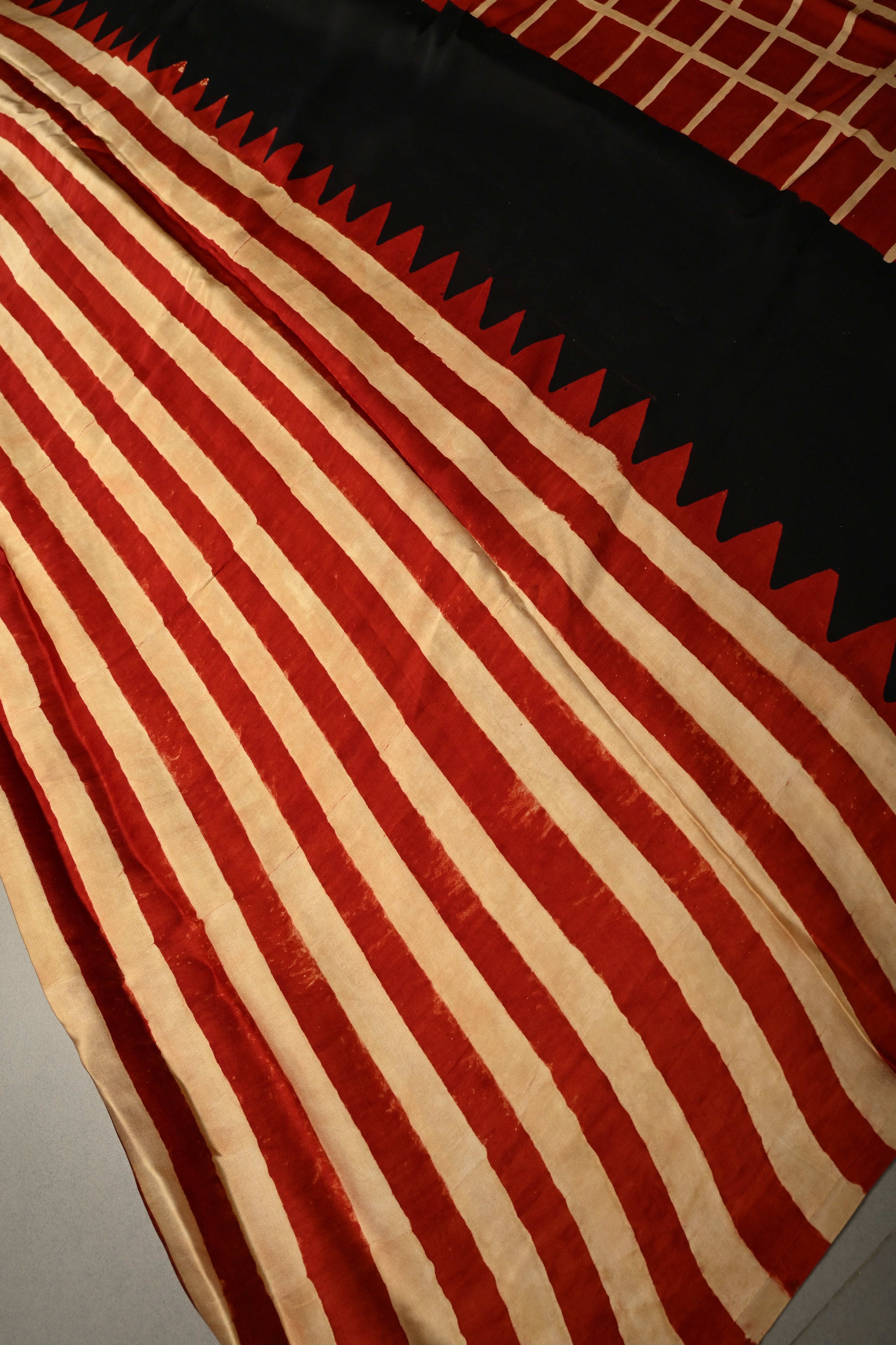 Beige-Red Borderless Modal Silk Saree with Stripes Hand Block Print and Contrast Black Checks Pattern Pallu | Shobitam