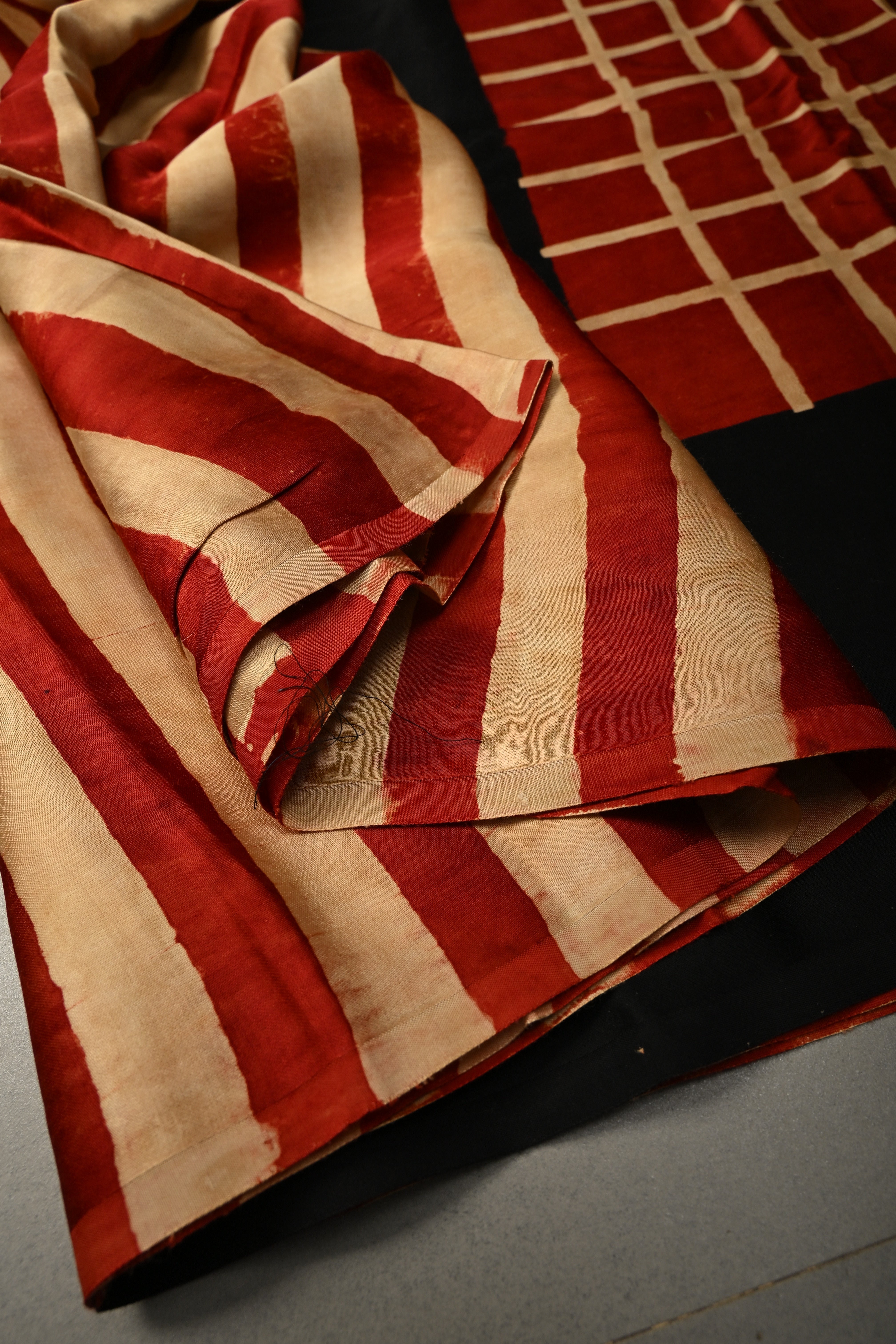 Beige-Red Borderless Modal Silk Saree with Stripes Hand Block Print and Contrast Black Checks Pattern Pallu | Shobitam