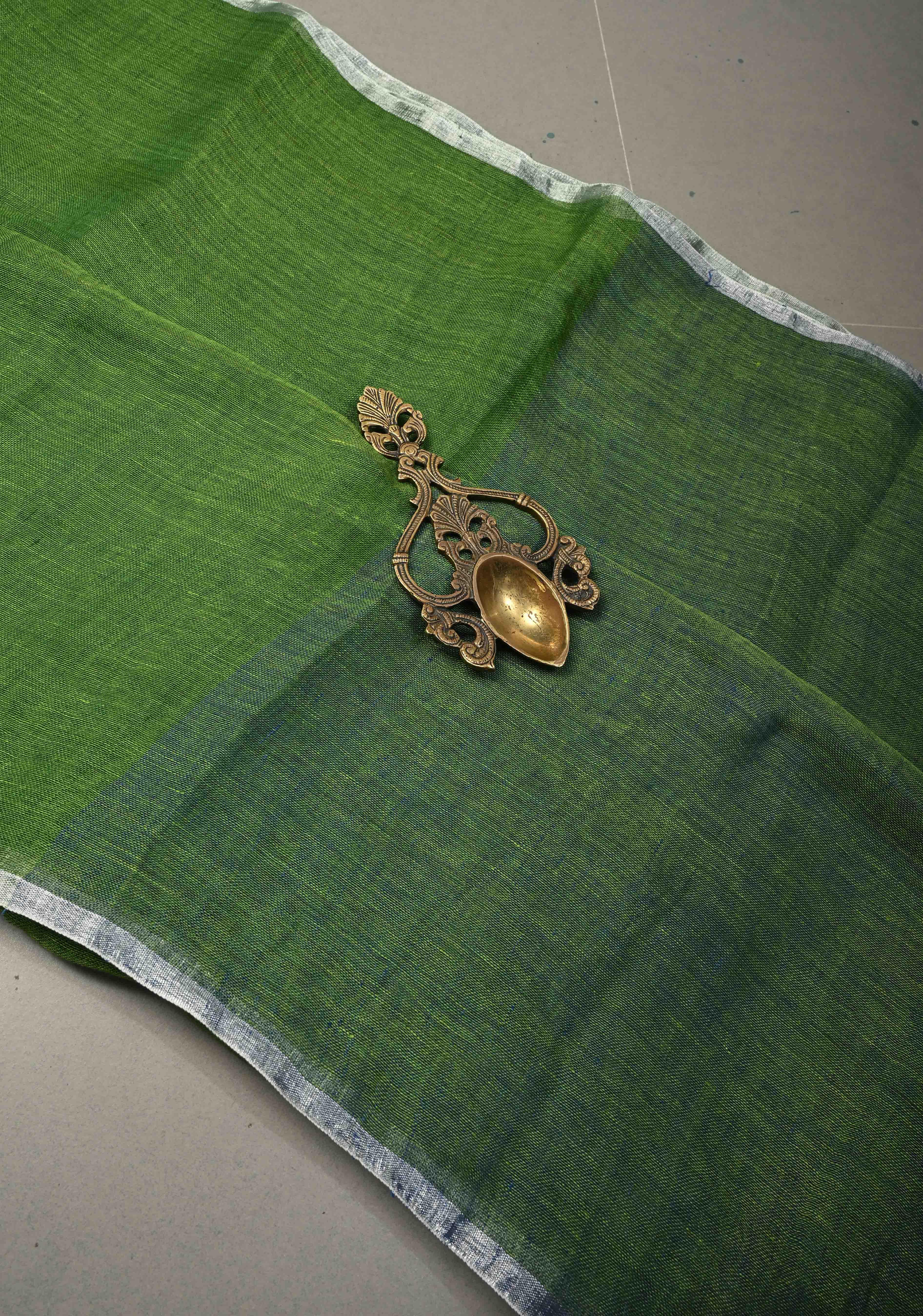 Grass Green Handloom Linen by Linen Saree with Minimal Tissue Border and Honeycomb Tassels | Shobitam