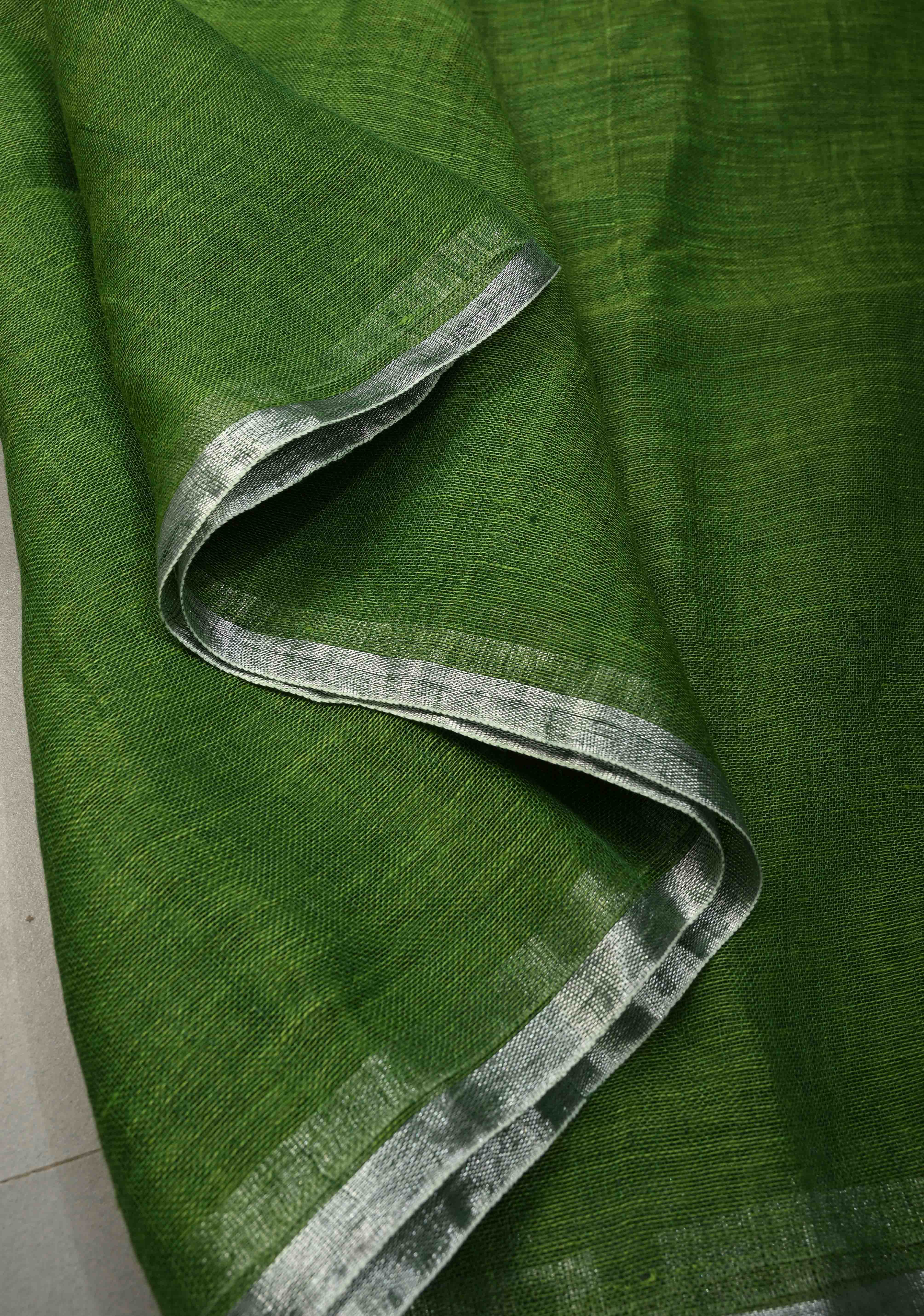 Grass Green Handloom Linen by Linen Saree with Minimal Tissue Border and Honeycomb Tassels | Shobitam