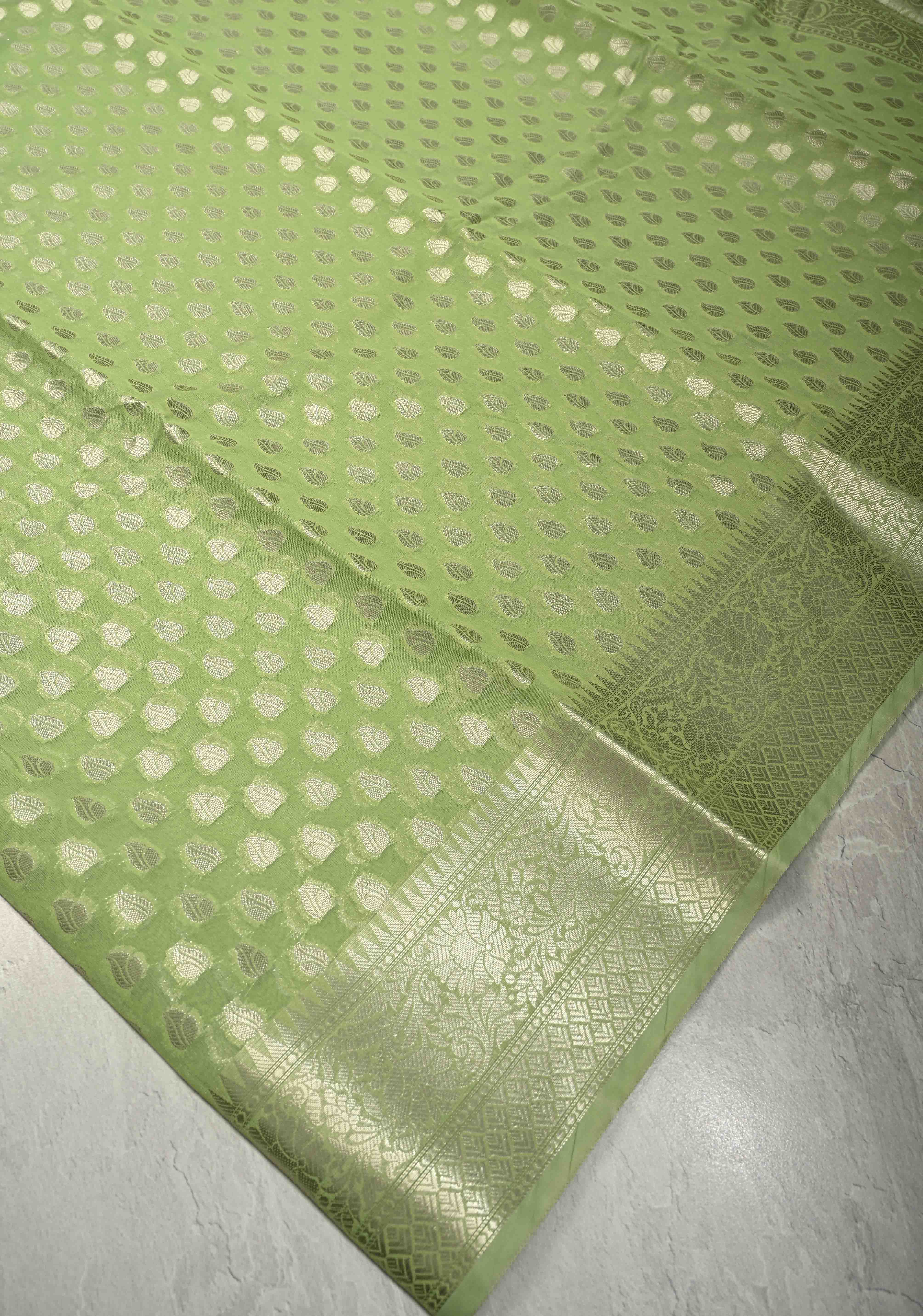 Pista Green Banarasi Semi Kora Saree with Silver Zari Buttas and Zari Border | Shobitam