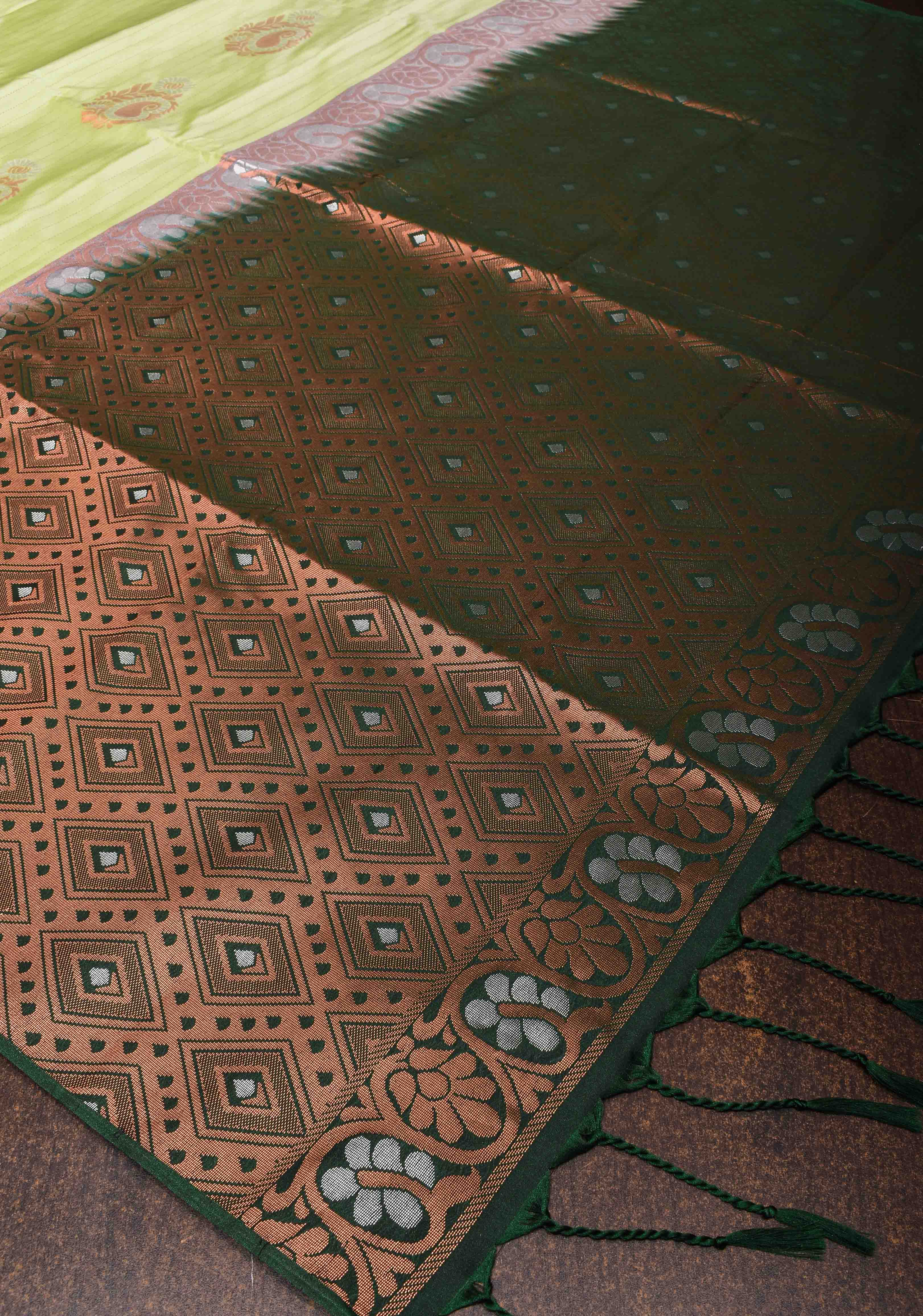 Tea Green Borderless Semi Silk Saree with Zari Stripes and Alfi Paisley Motifs | Shobitam