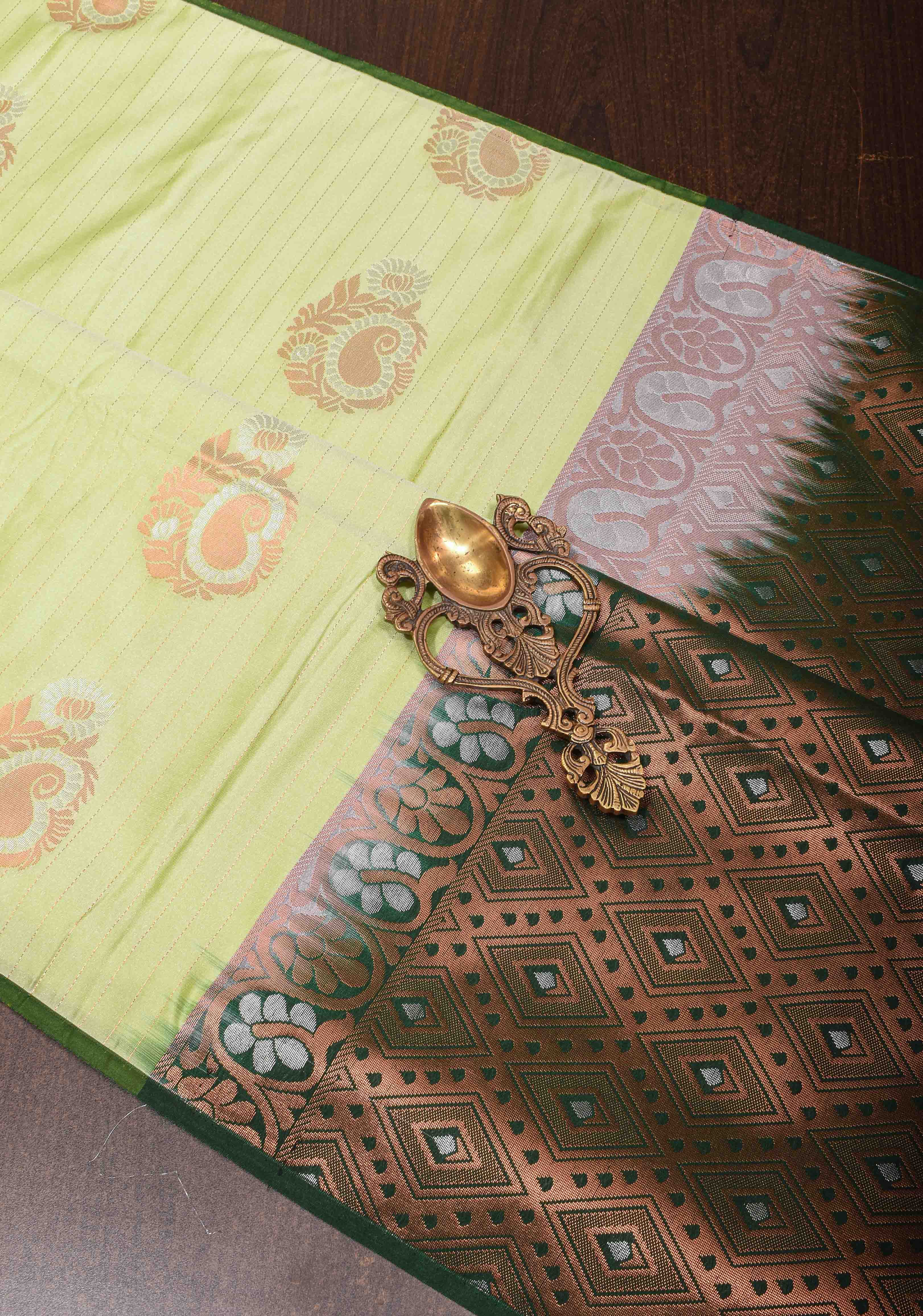 Tea Green Borderless Semi Silk Saree with Zari Stripes and Alfi Paisley Motifs | Shobitam