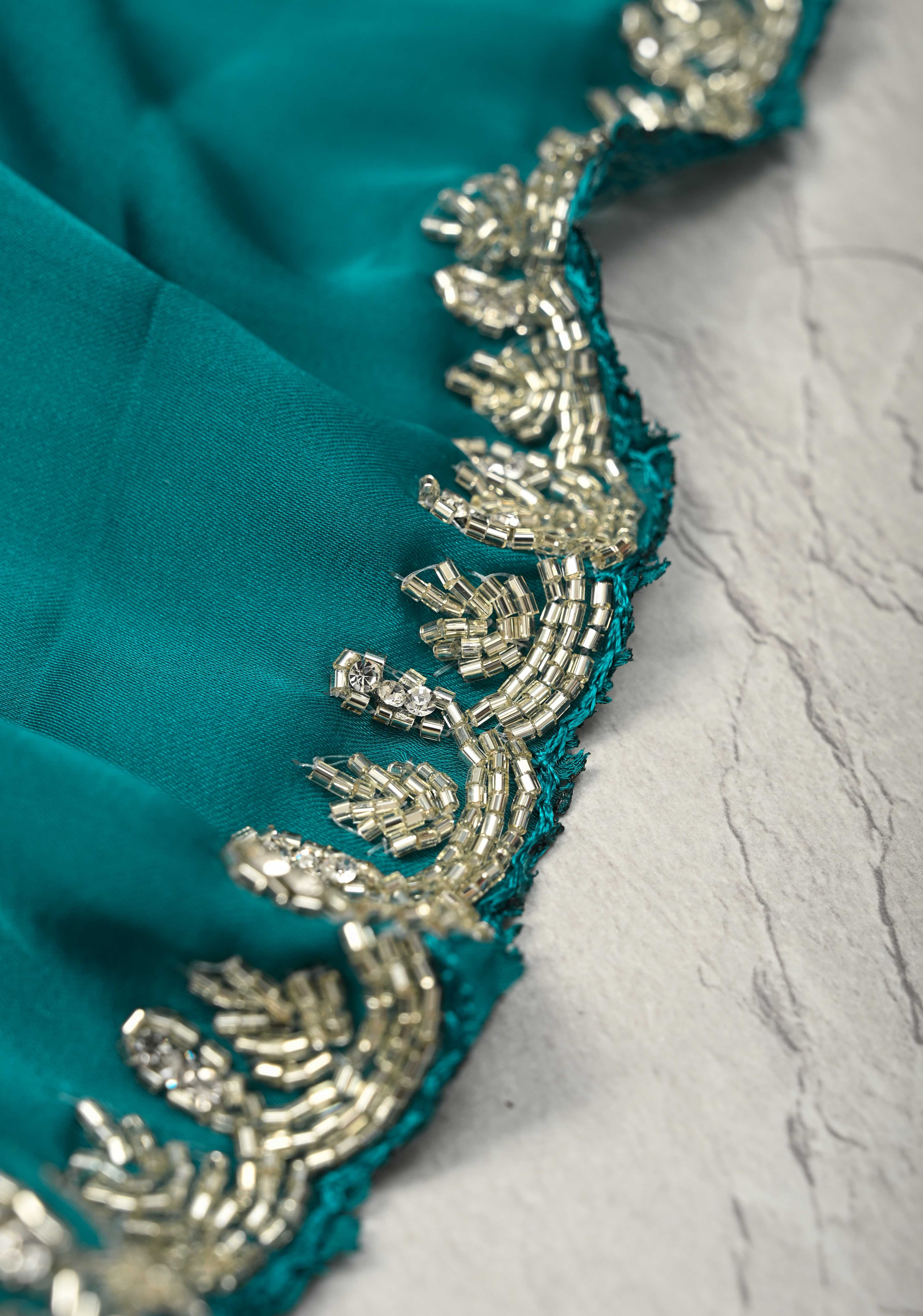 Teal  Satin Geoergette Saree with minimal cutdana borders | Shobitam