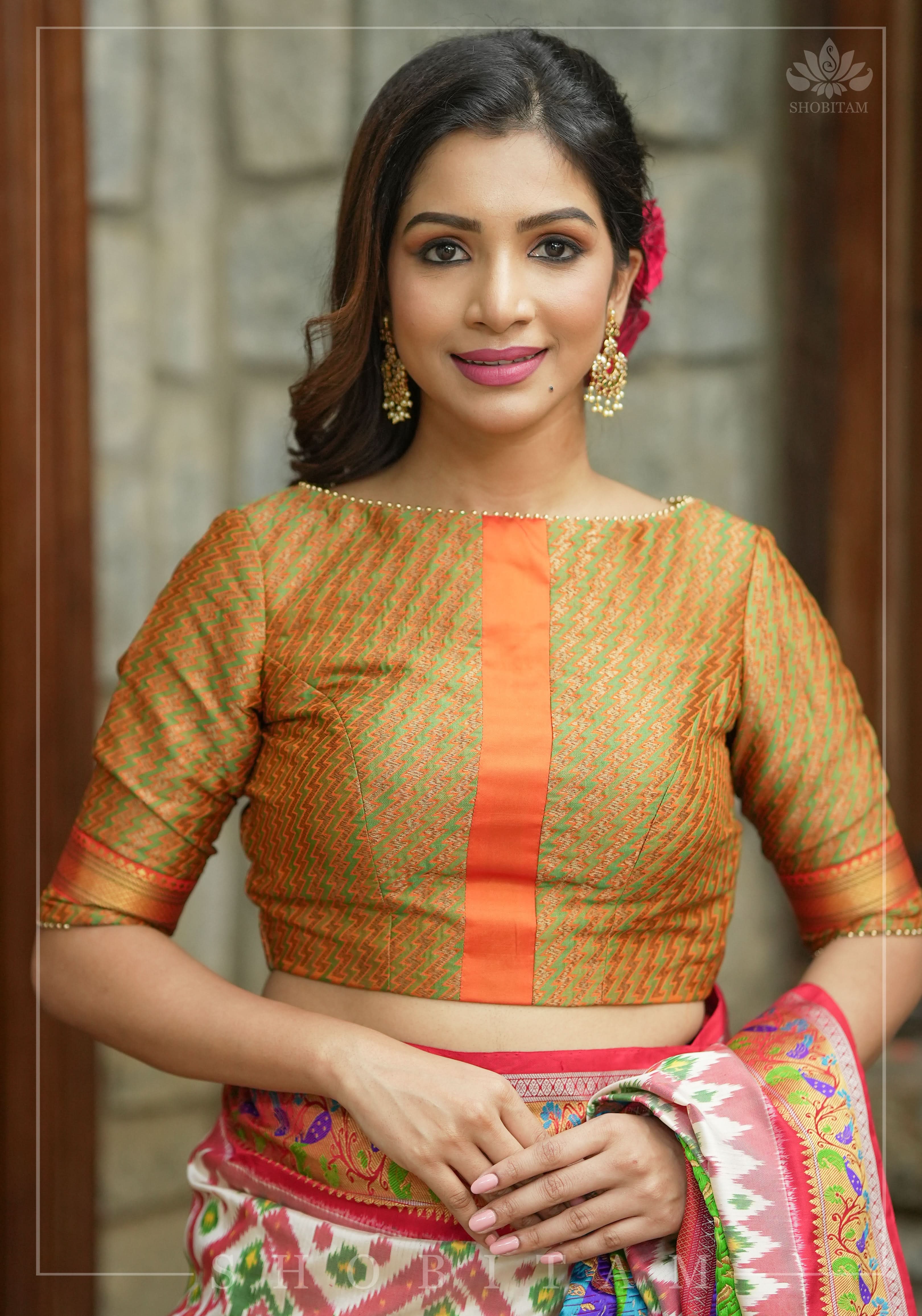 Henna Green and orange Jacquard boatneck blouse with plain silk detailing, Made to Order | Shobitam