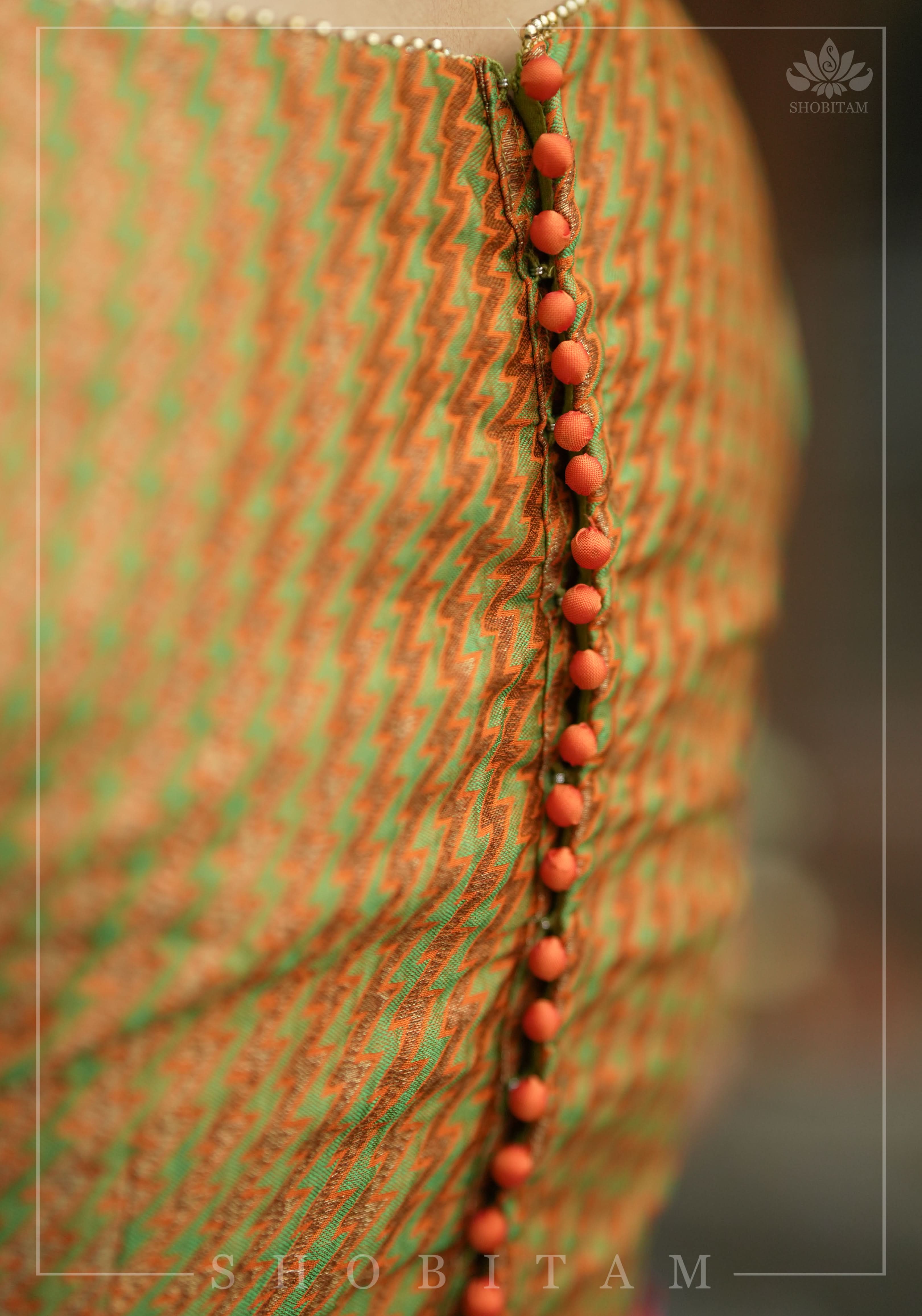 Henna Green and orange Jacquard boatneck blouse with plain silk detailing, Made to Order | Shobitam