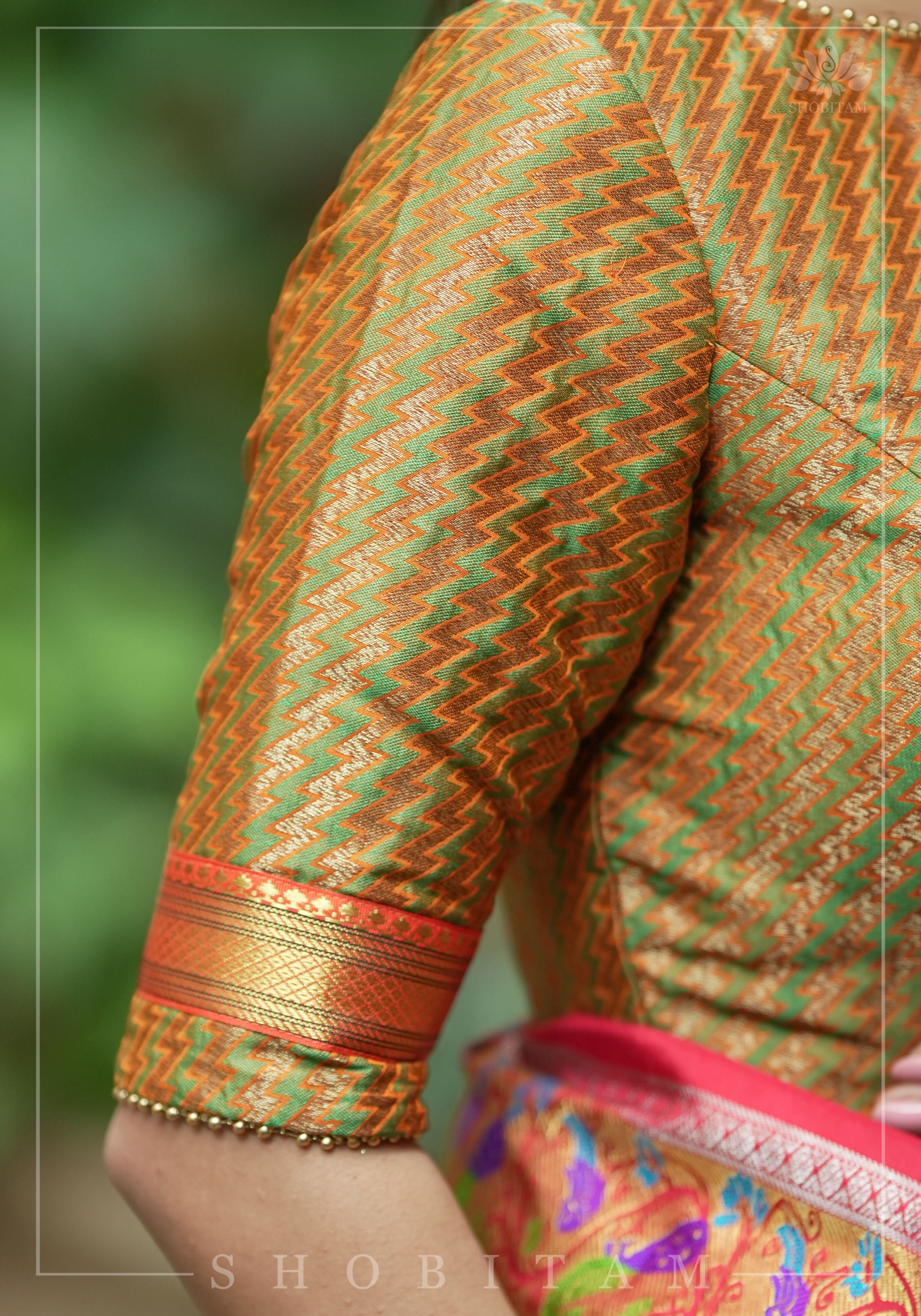 Henna Green and orange Jacquard boatneck blouse with plain silk detailing, Made to Order | Shobitam
