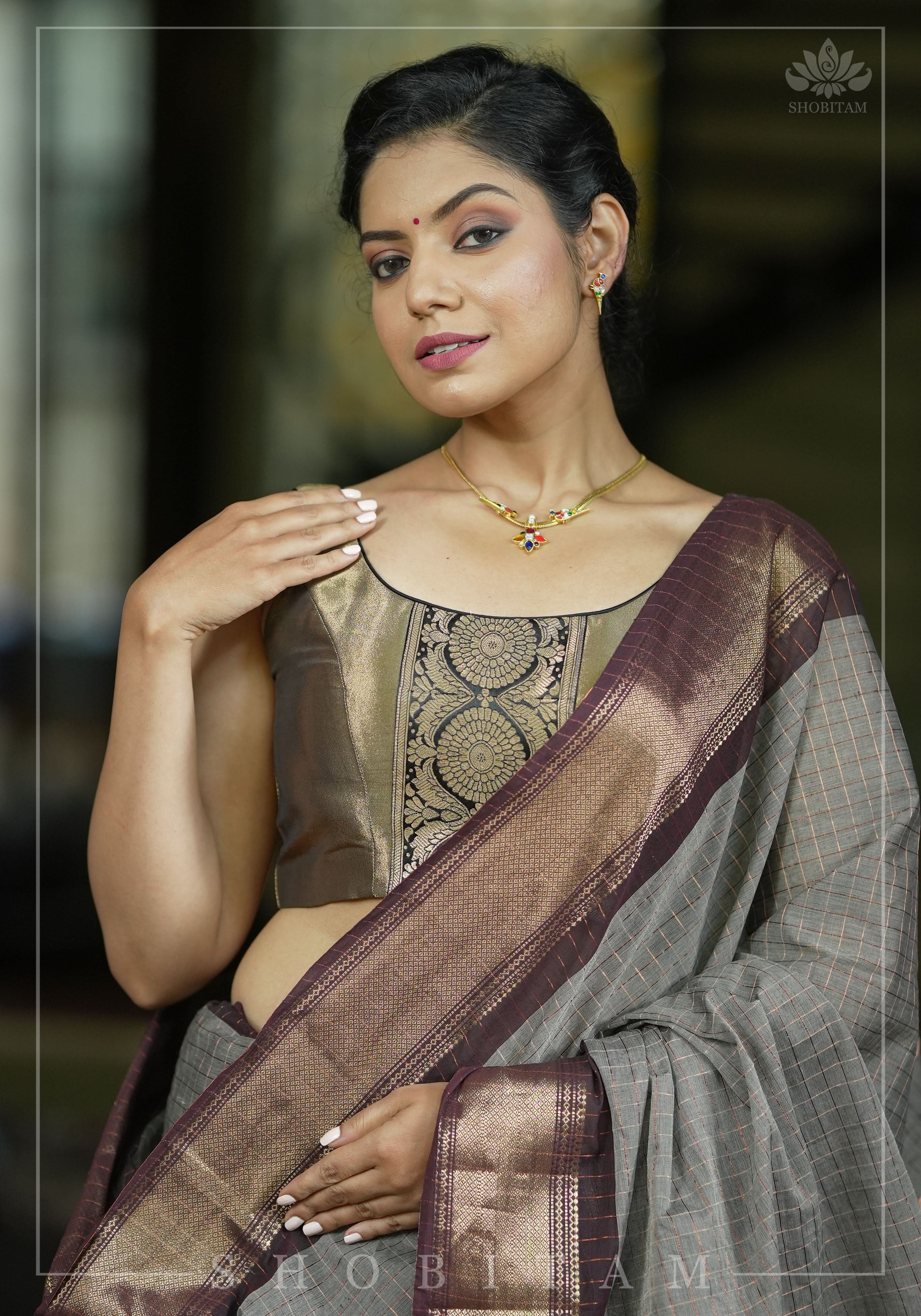 Bronze tissue brocade U  neck sleeveless blouse with black brocade detailing | Shobitam