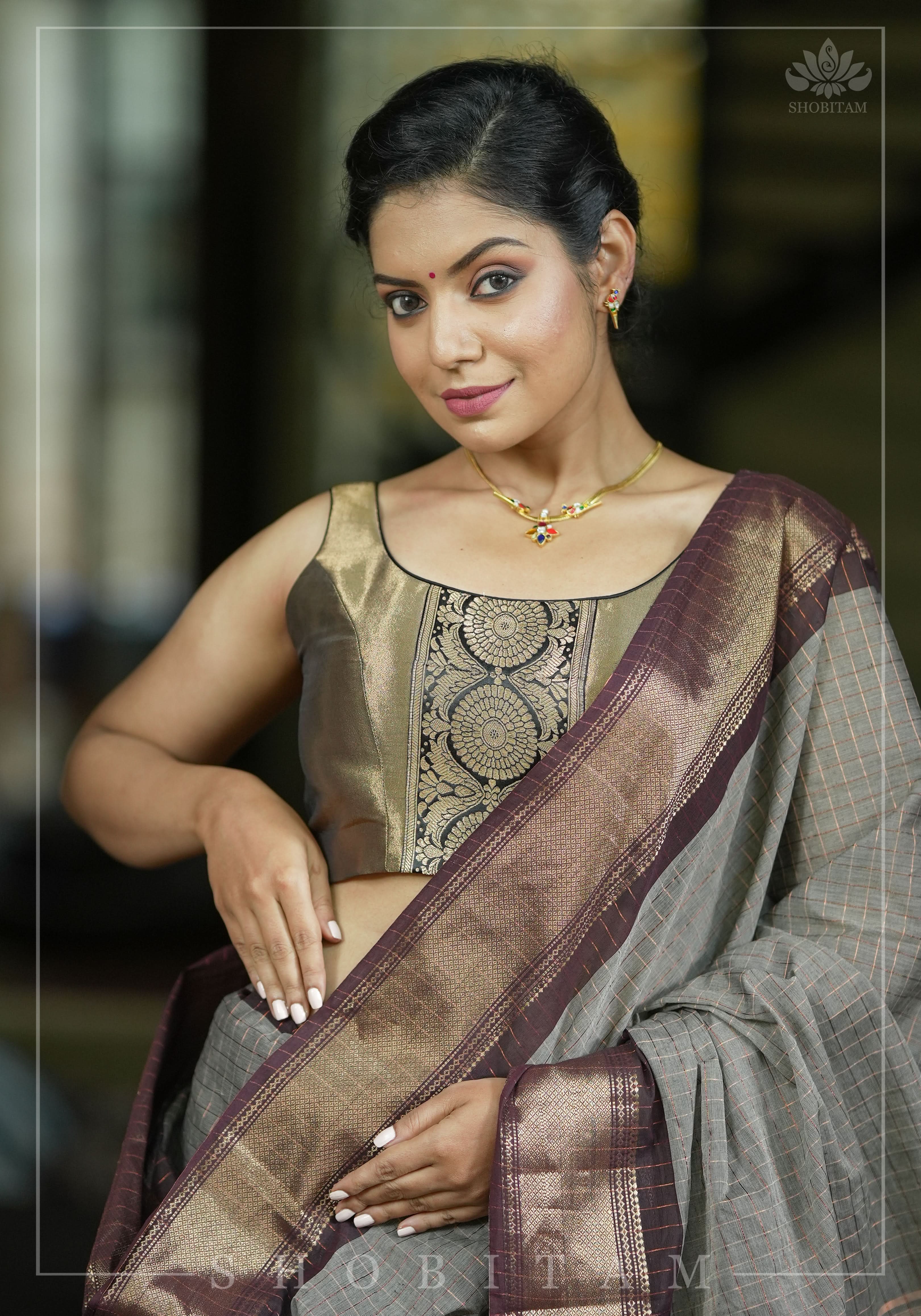 Bronze tissue brocade U  neck sleeveless blouse with black brocade detailing | Shobitam
