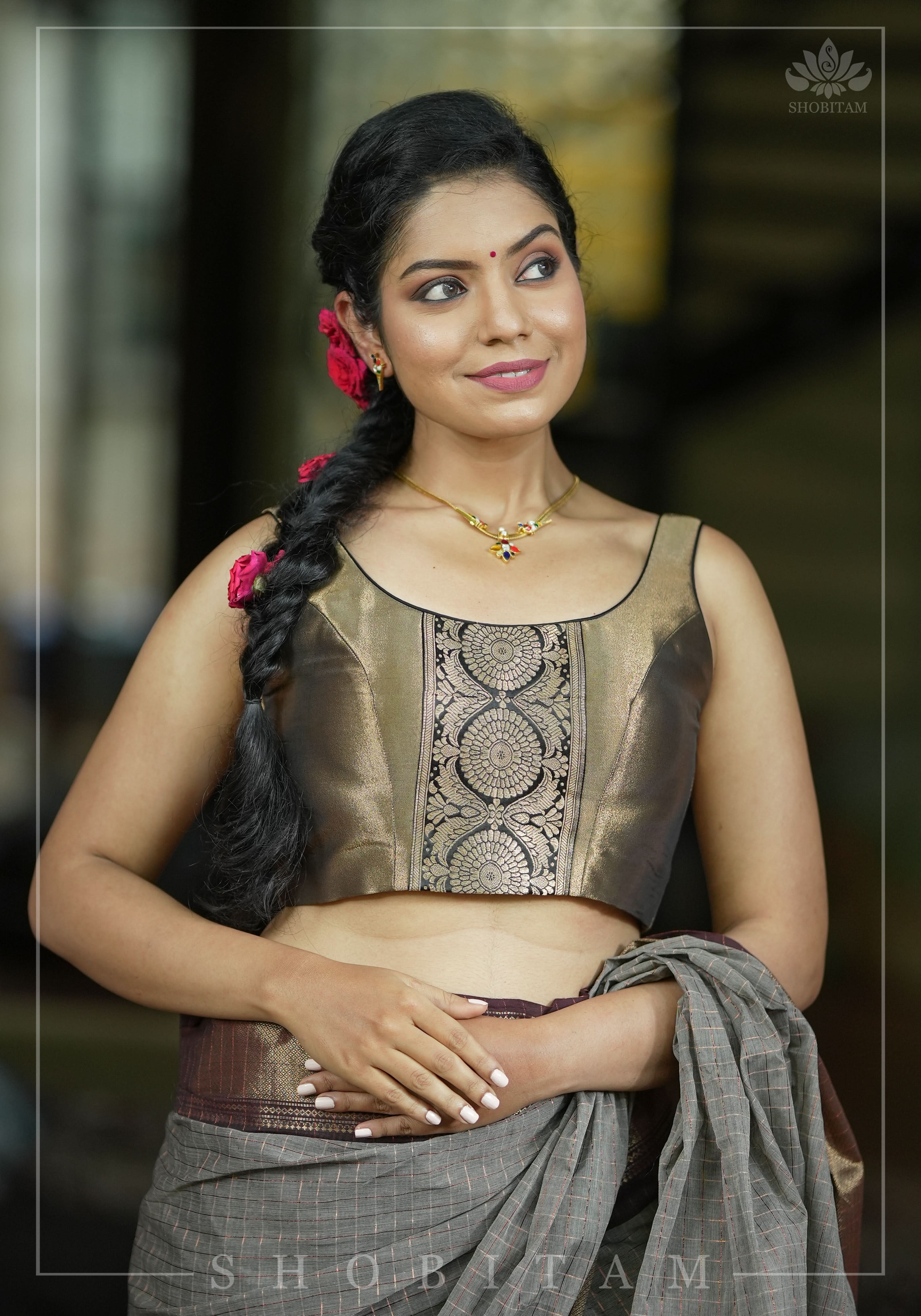 Bronze tissue brocade U  neck sleeveless blouse with black brocade detailing | Shobitam