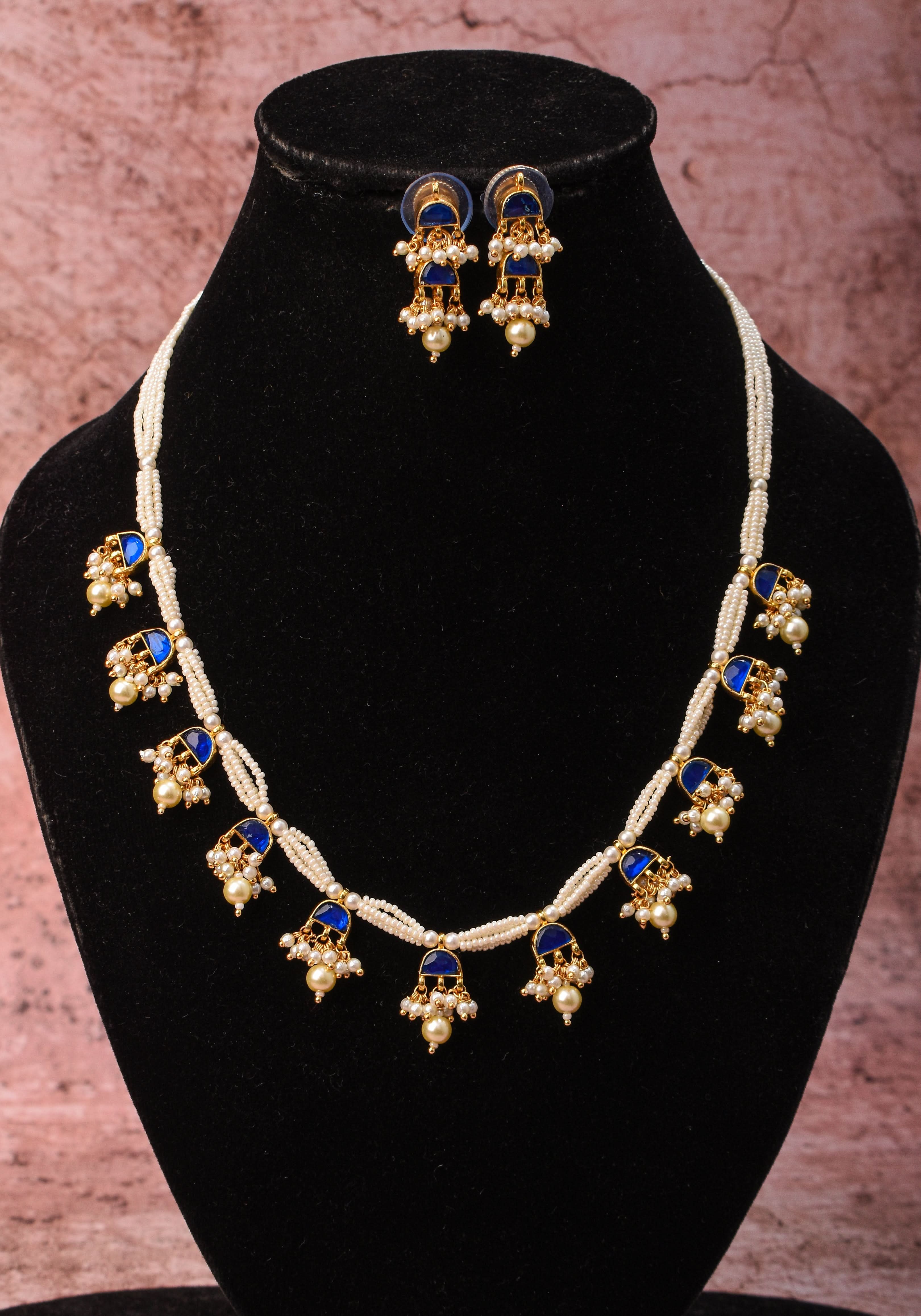 Lightweight Jadau Necklace Set with eleven dangling royal blue stones and matching earrings | Shobitam Jewelry