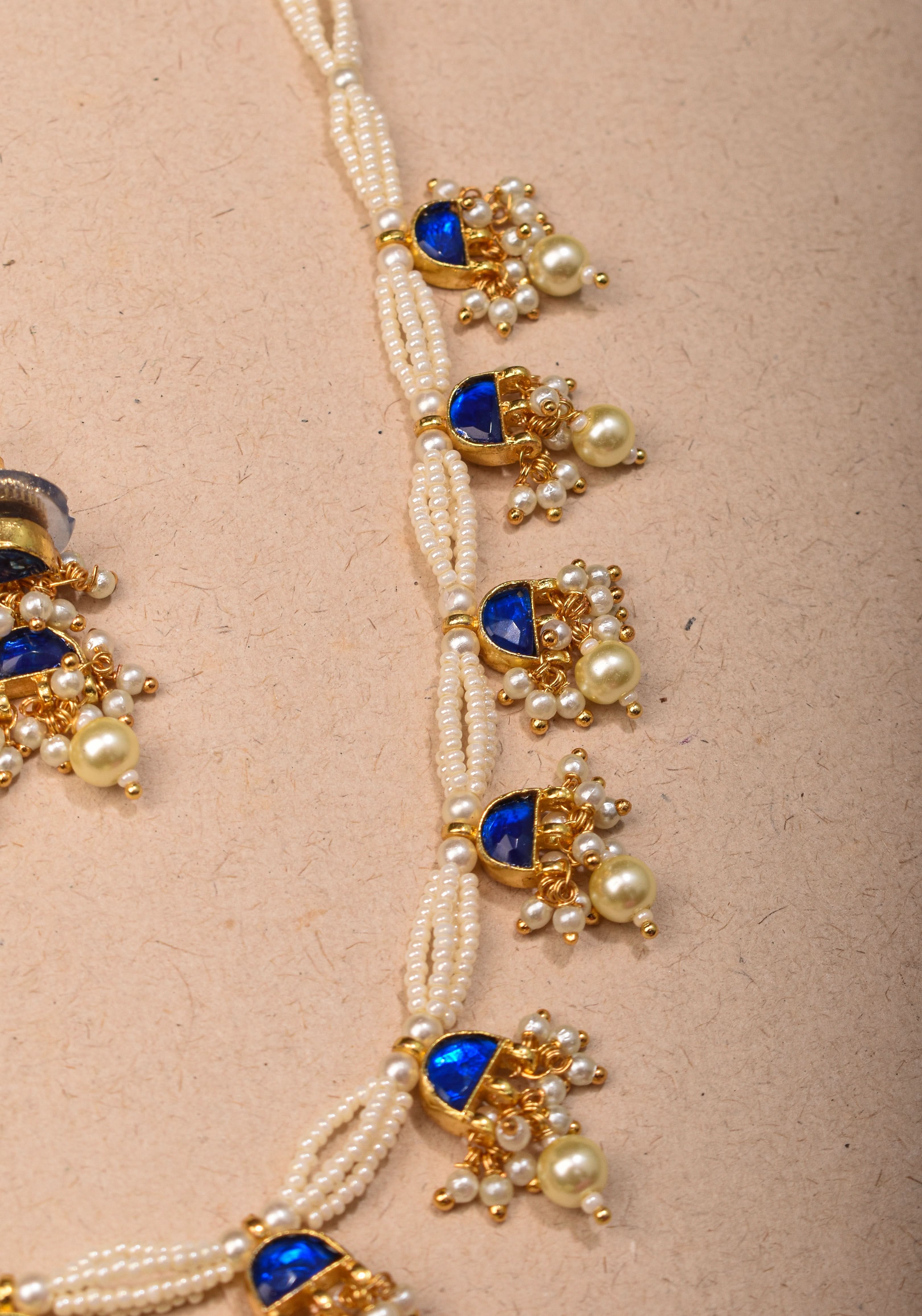 Lightweight Jadau Necklace Set with eleven dangling royal blue stones and matching earrings | Shobitam Jewelry