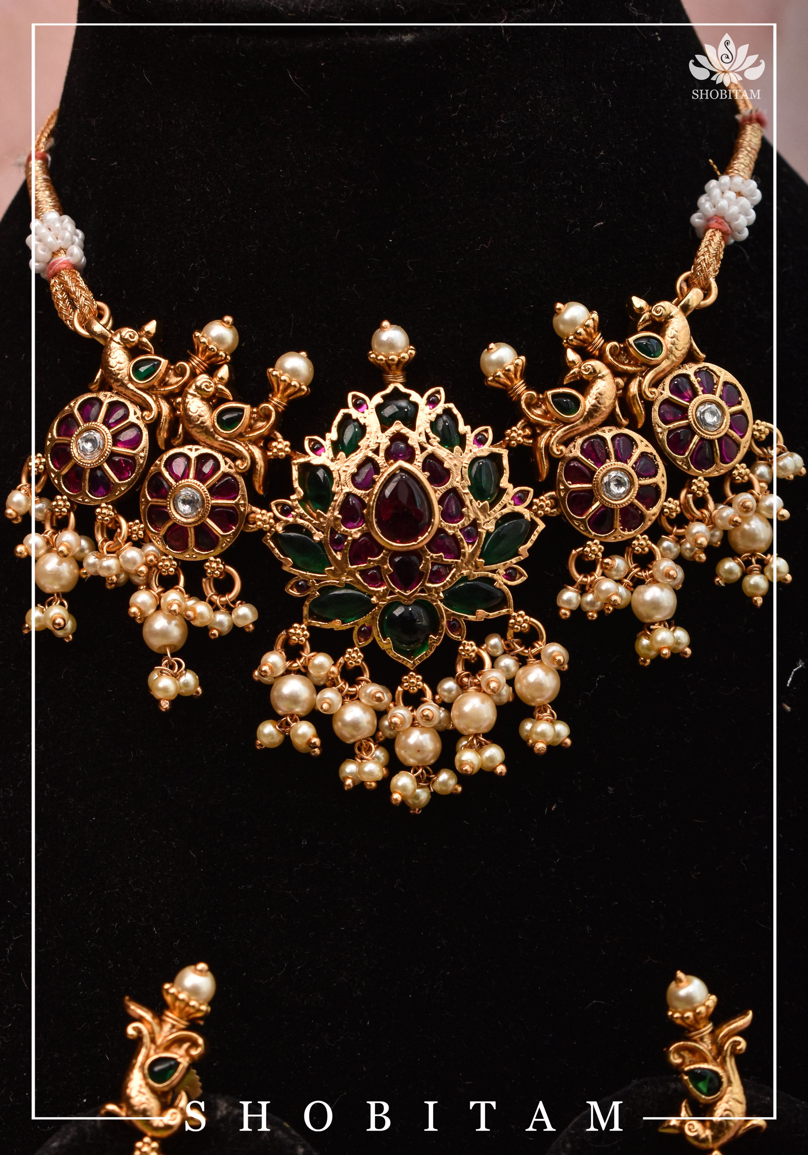 Jadau Lotus Stone Embellishment with Peacock units Choker Set In Green,Pink and white With Matching Earrings | Shobitam
