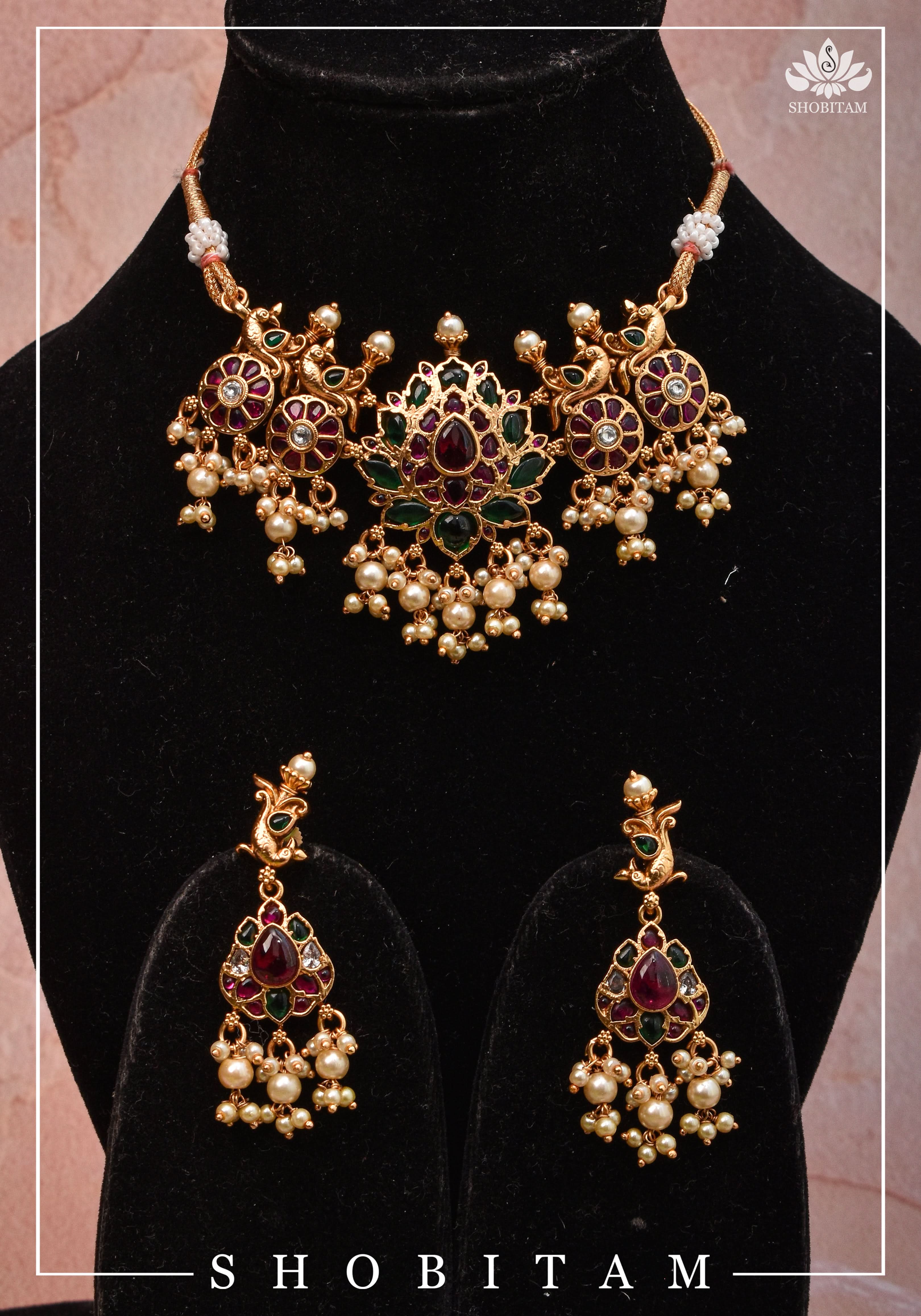 Jadau Lotus Stone Embellishment with Peacock units Choker Set In Green,Pink and white With Matching Earrings | Shobitam