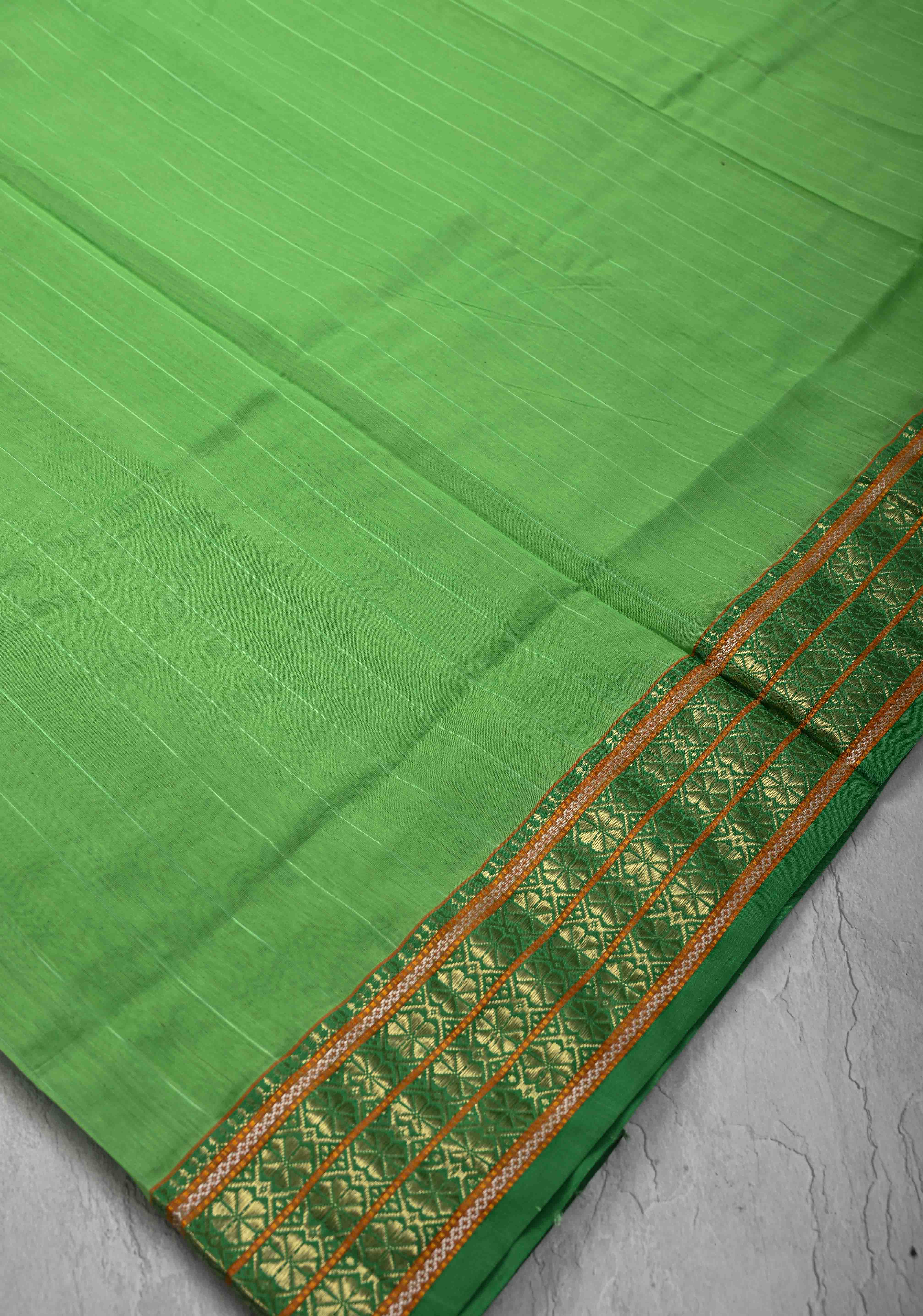 Parrot Green Handwoven Maheshwari Silk Cotton Saree with Muted Stripes and Zari Borders | Shobitam