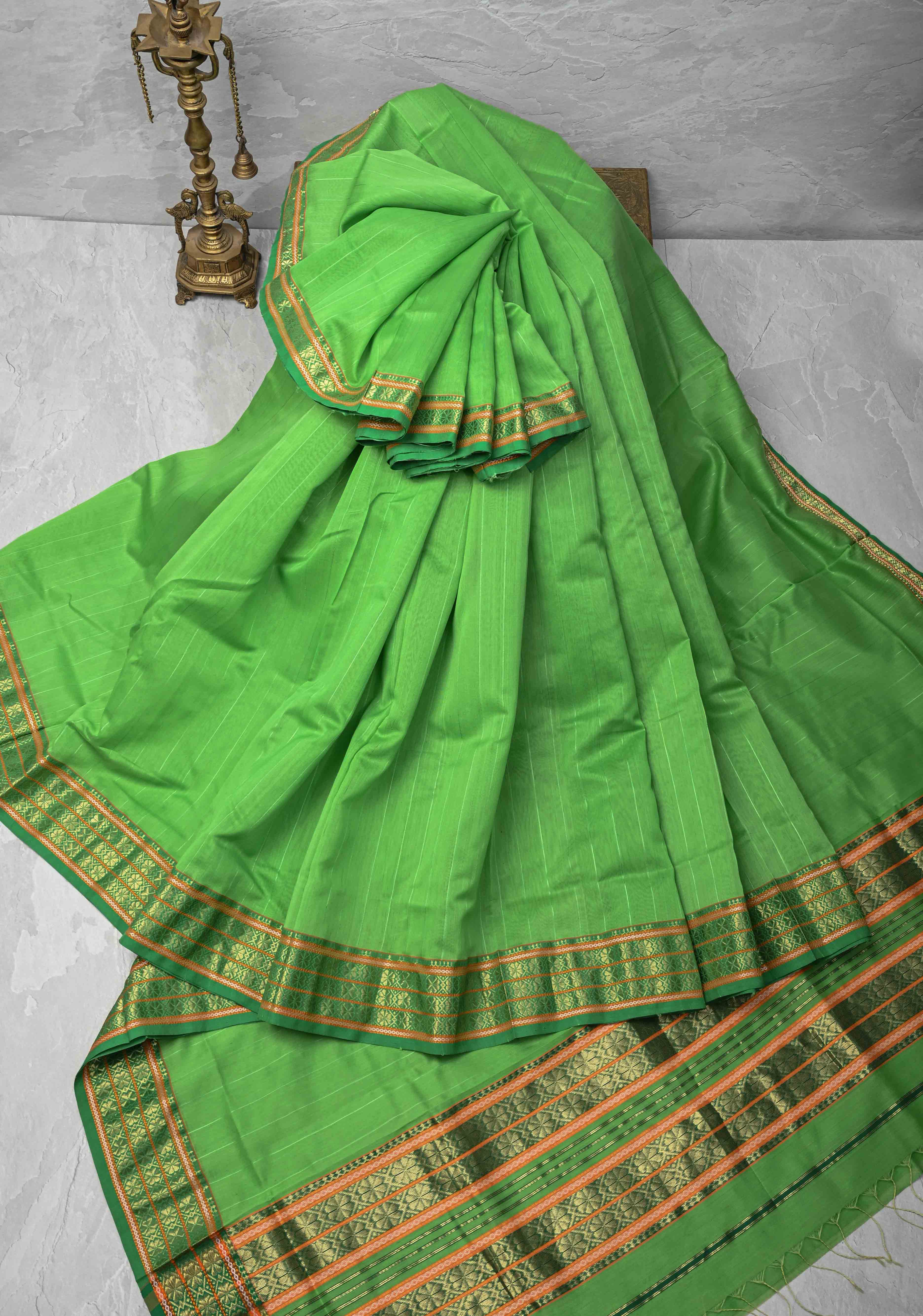 Parrot Green Handwoven Maheshwari Silk Cotton Saree with Muted Stripes and Zari Borders | Shobitam