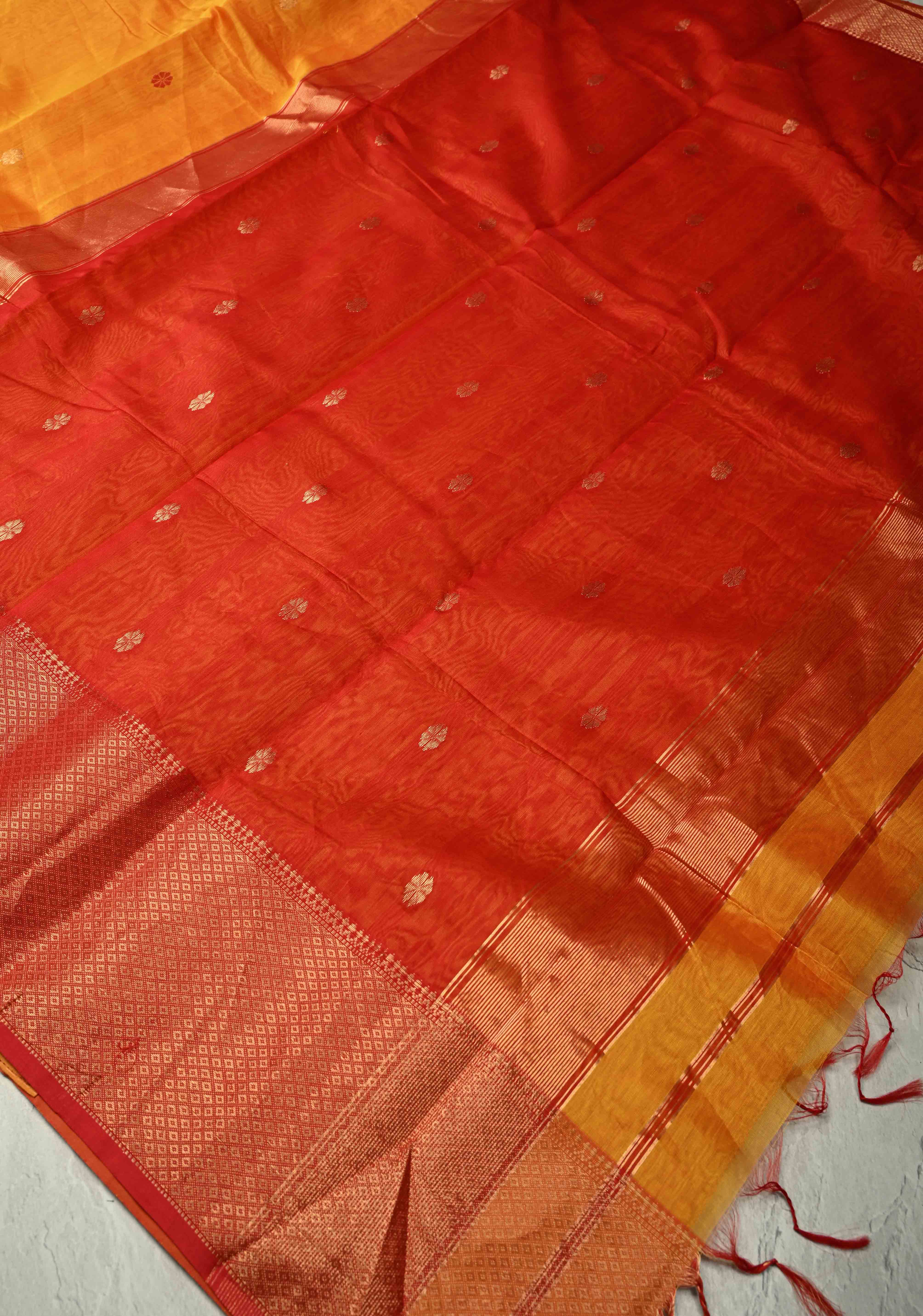 Yellowish Orange Dual Tone Handwoven Maheshwari Silk Cotton Saree with Resham Buttas and Contrast Border